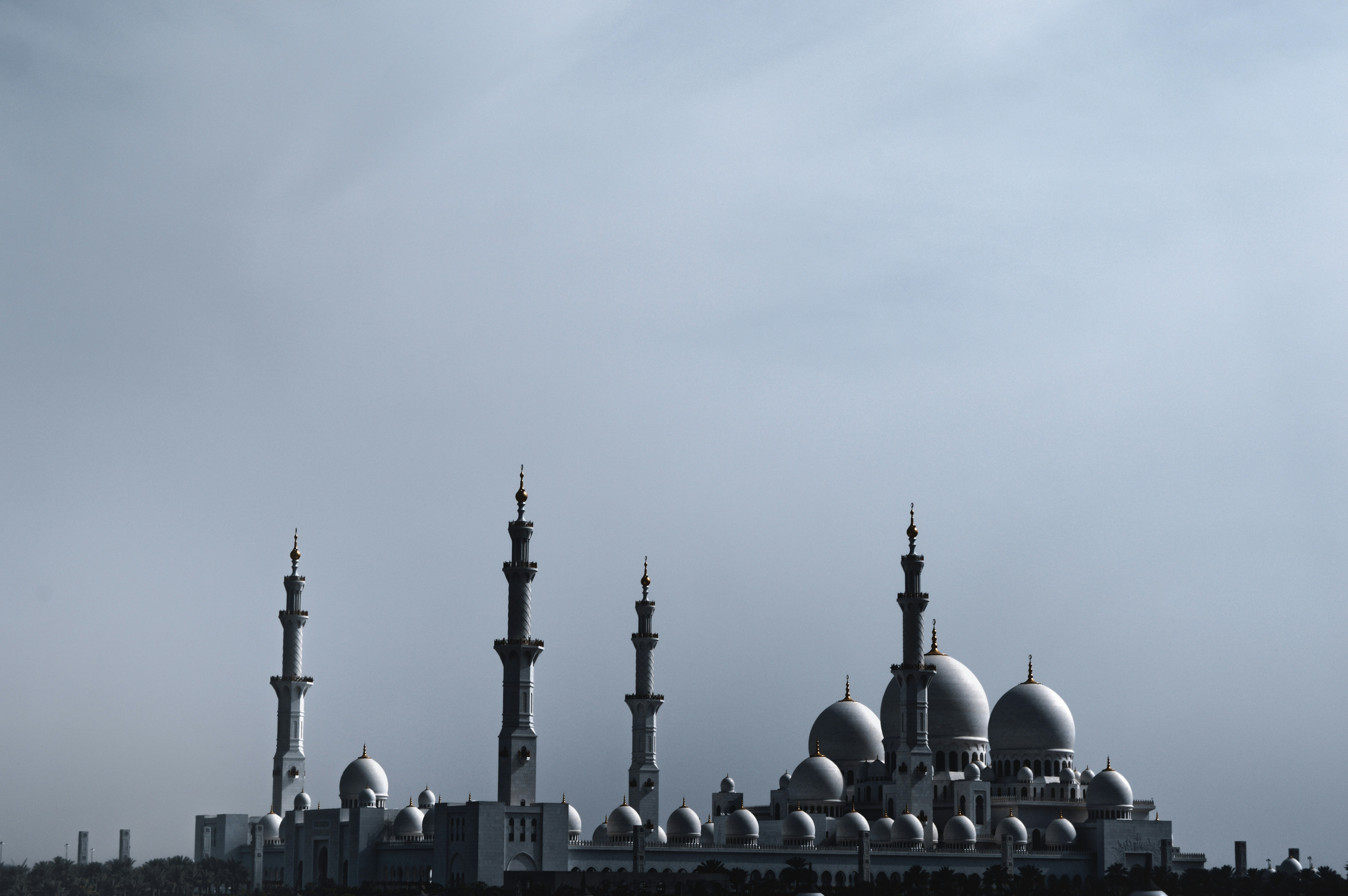 A very tall building with many spires on top of it