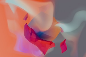 A blurry image of a red and pink flower