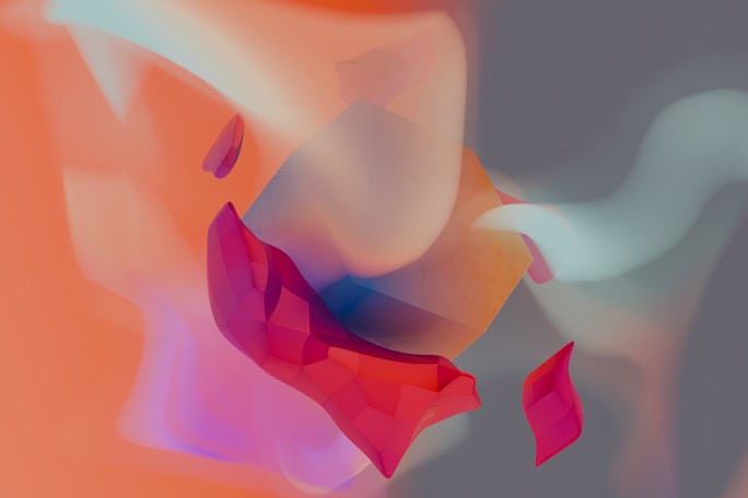A blurry image of a red and pink flower