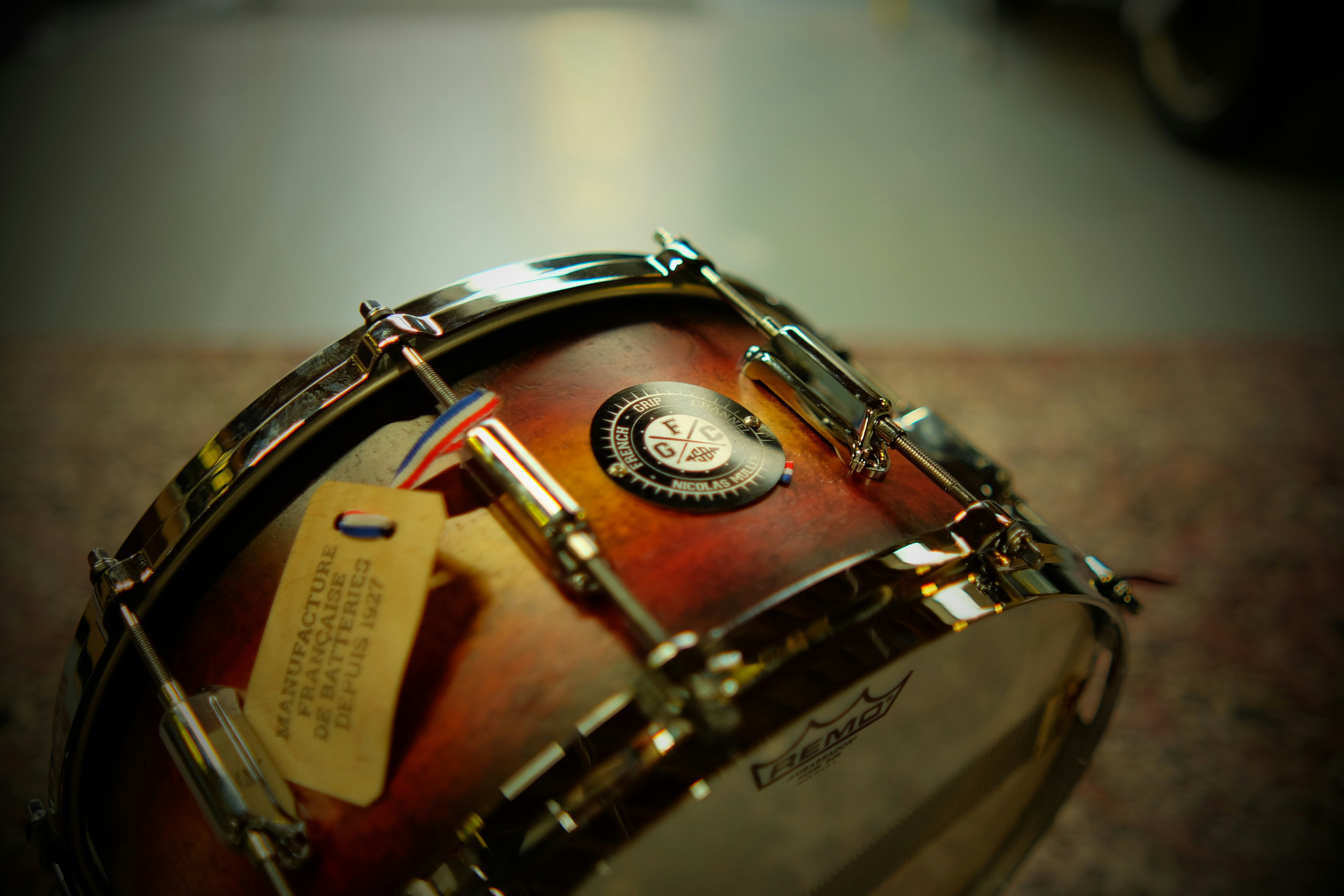 A close up of a drum with a note on it
