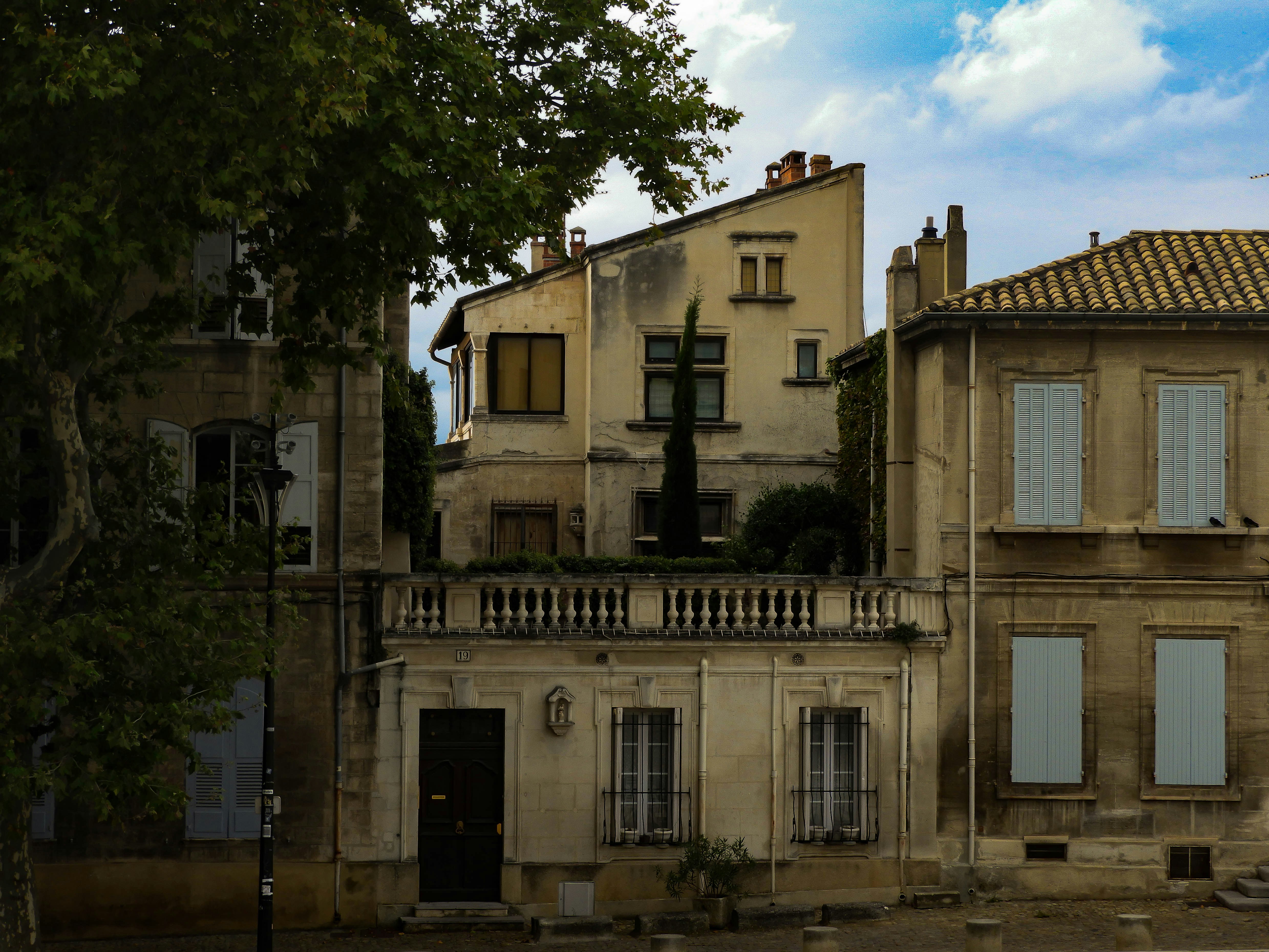 An old building with a cross on the top of it