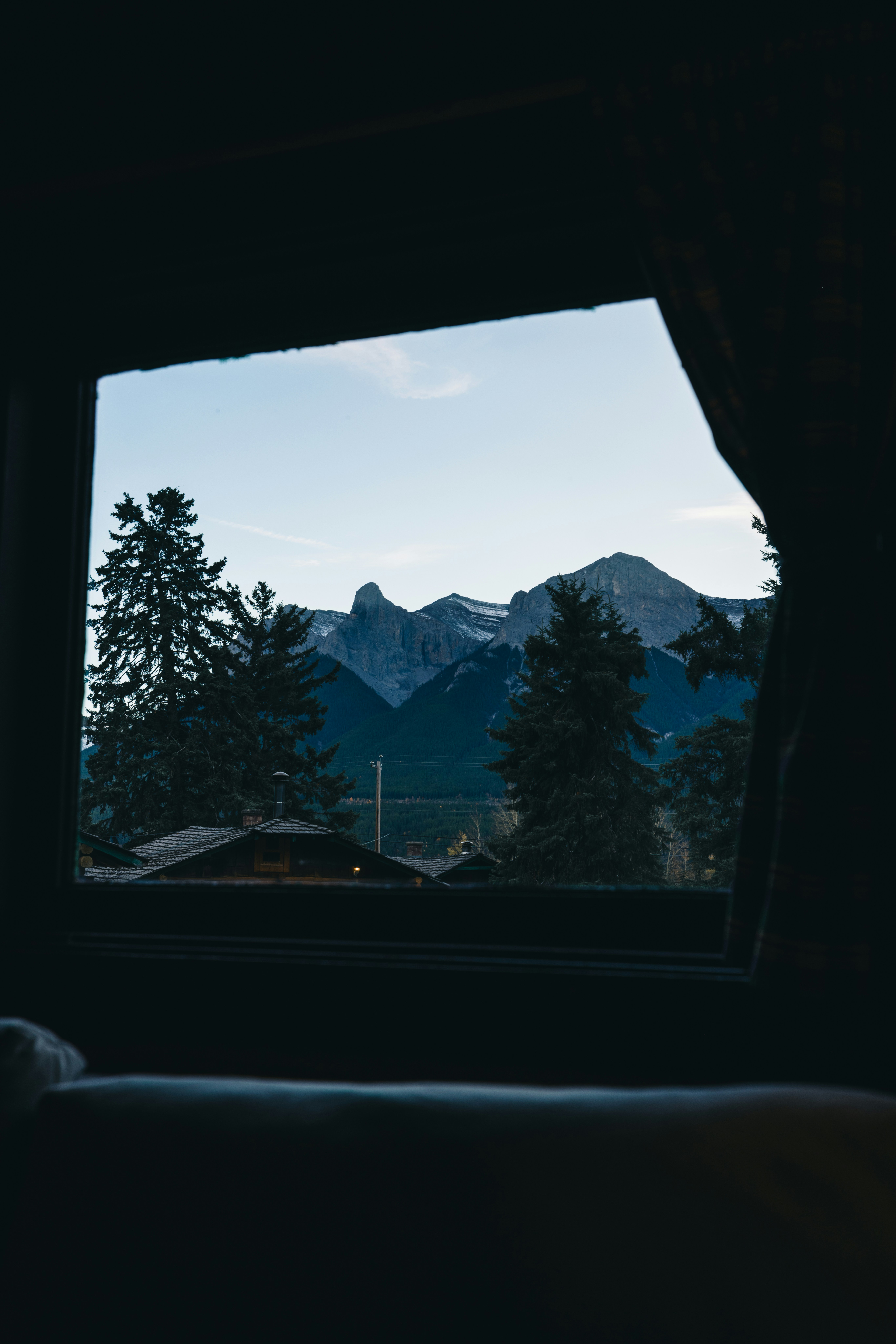 A view out a window of a mountain range