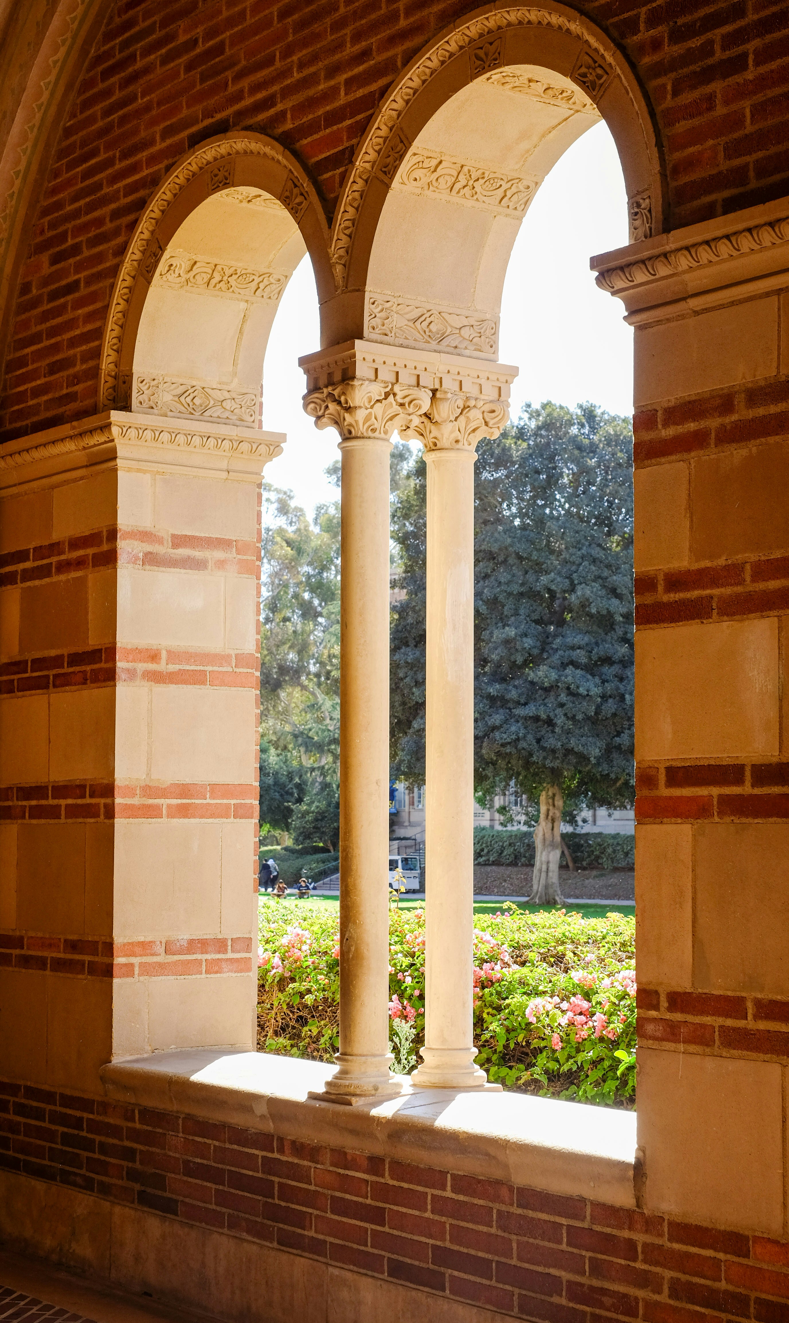 An arched window in a brick building photo – Free Ucla Image on Unsplash