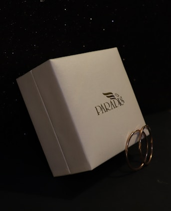 A white box with two rings on it