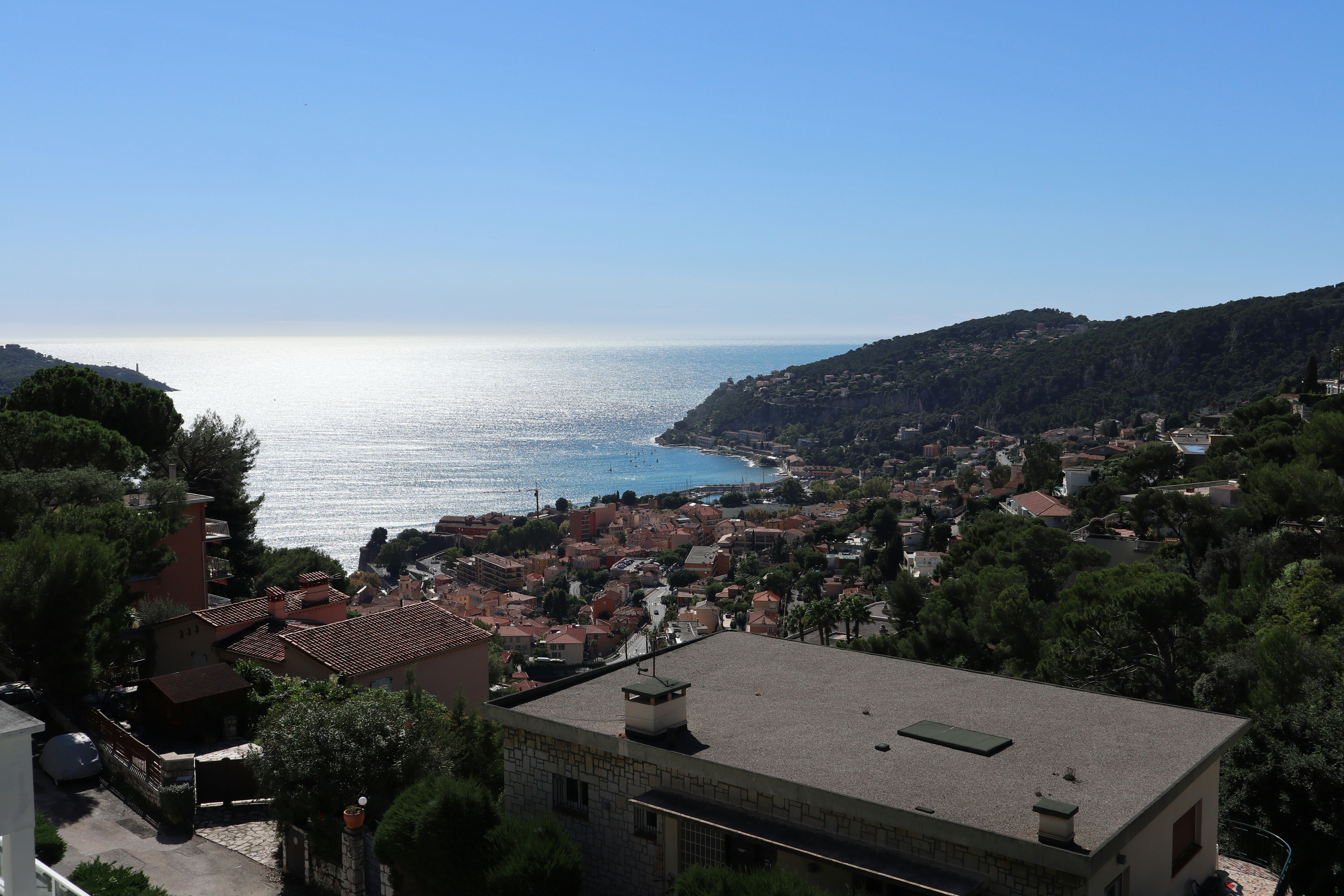 A view of the ocean from the top of a hill