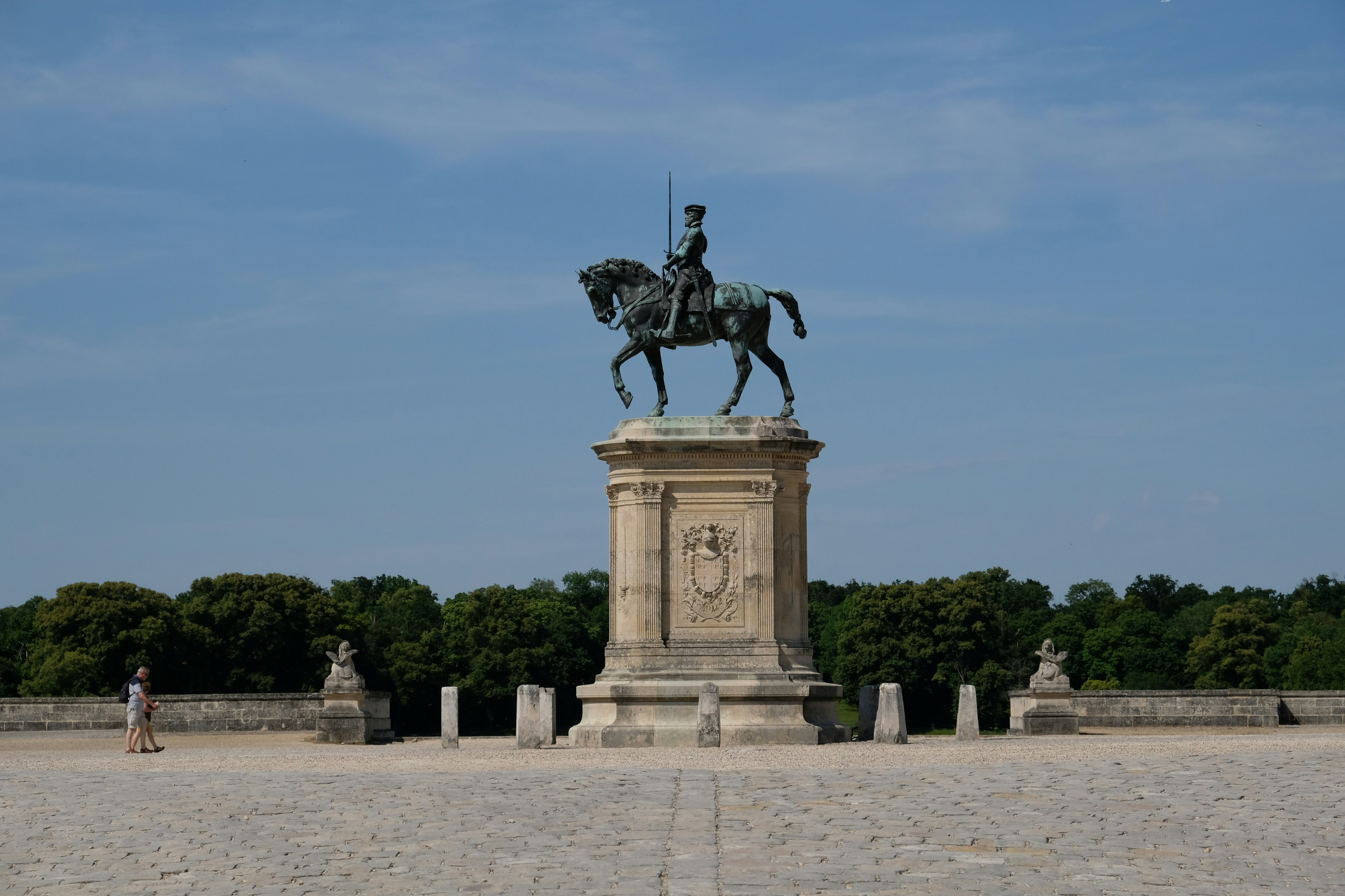 A statue of a man on a horse in a courtyard