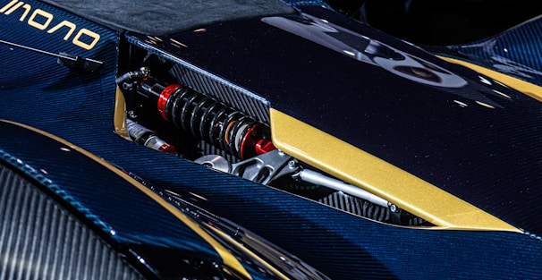 A close up of a blue and yellow motorcycle
