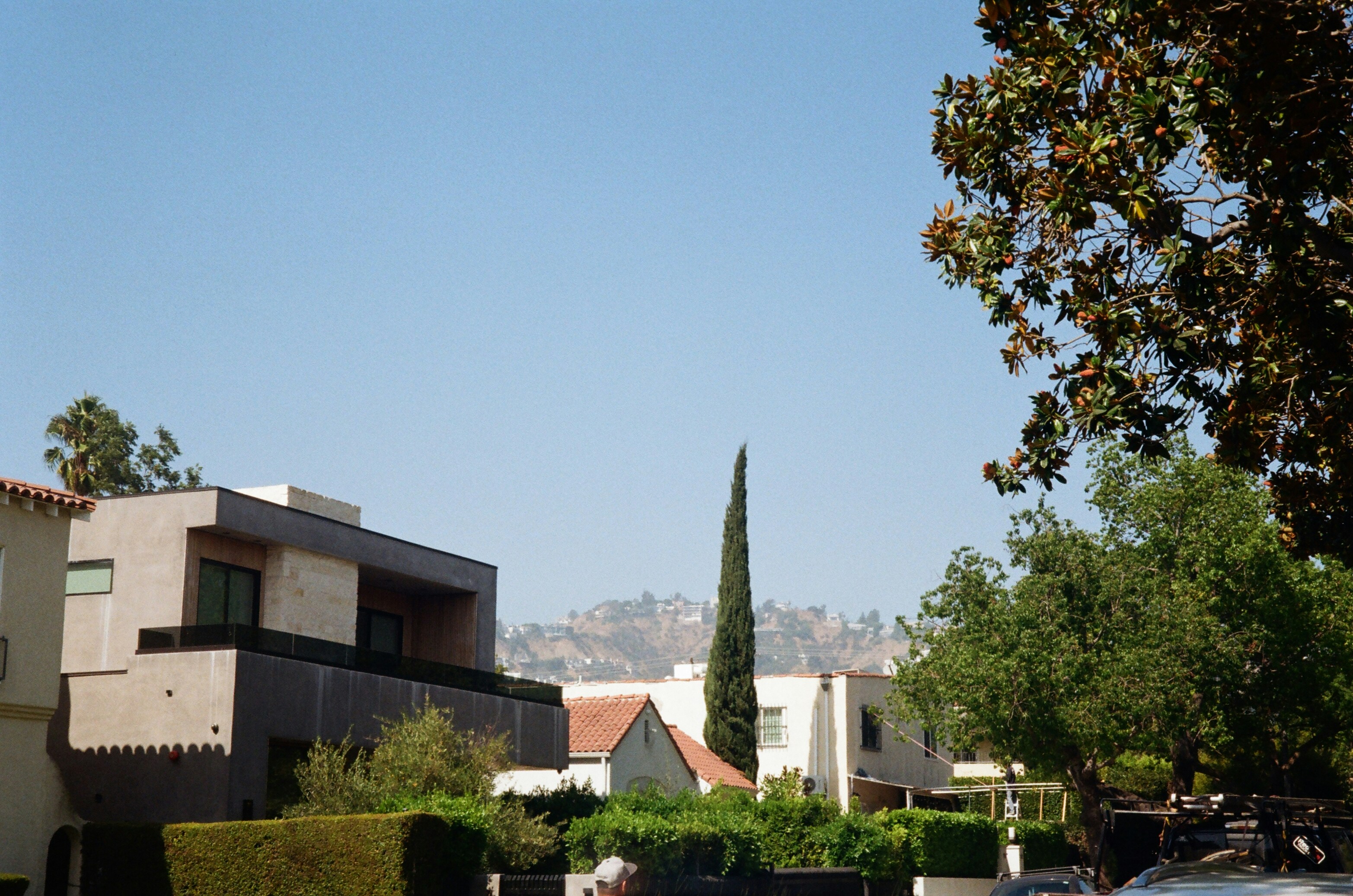 A view of a street with houses in the background