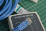 A close up of a network tester on a table