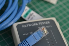 A close up of a network tester on a table