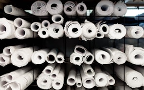 A rack full of rolls of white toilet paper