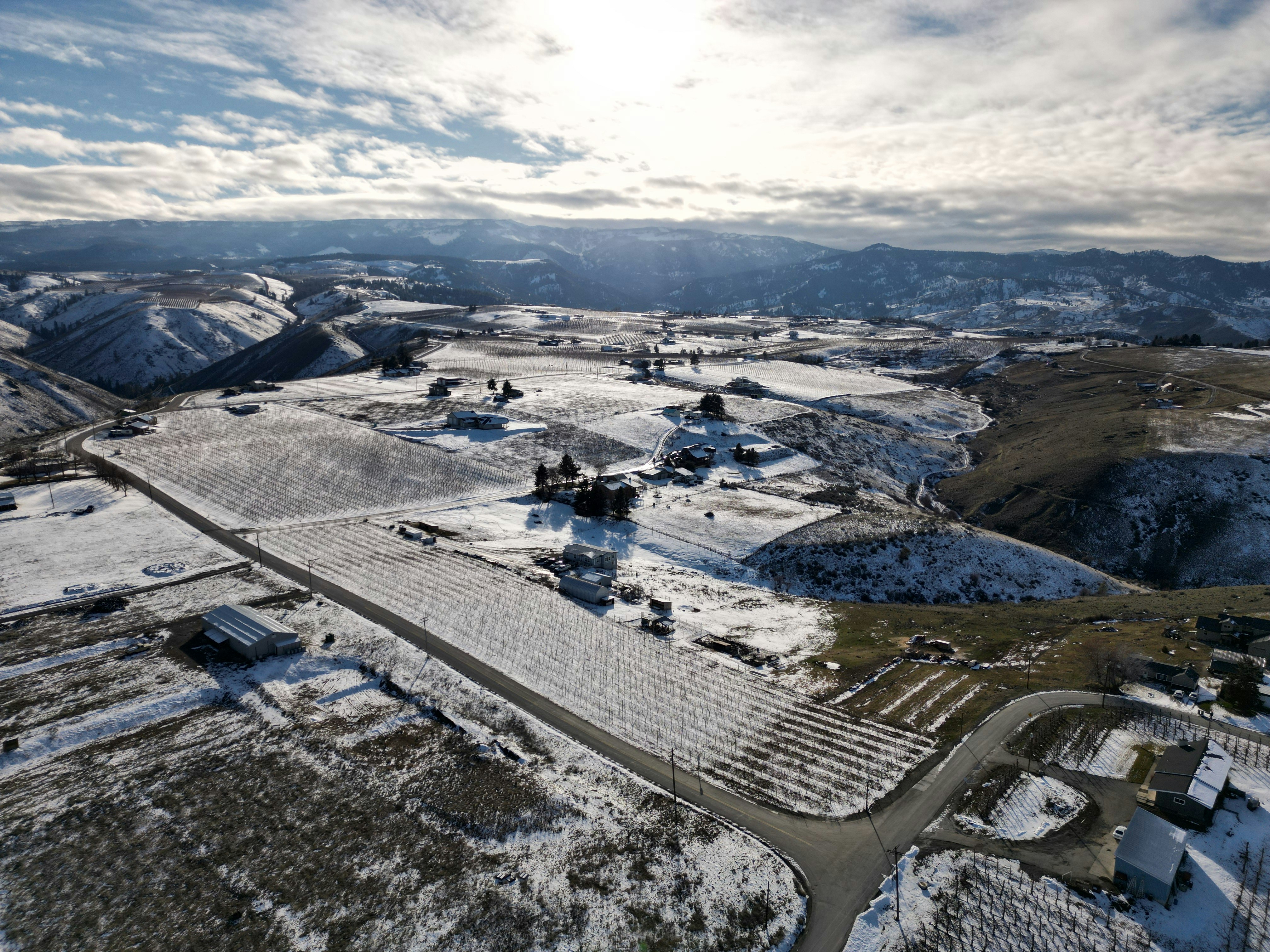 An aerial view of a snow covered landscape photo – Free White Image on ...