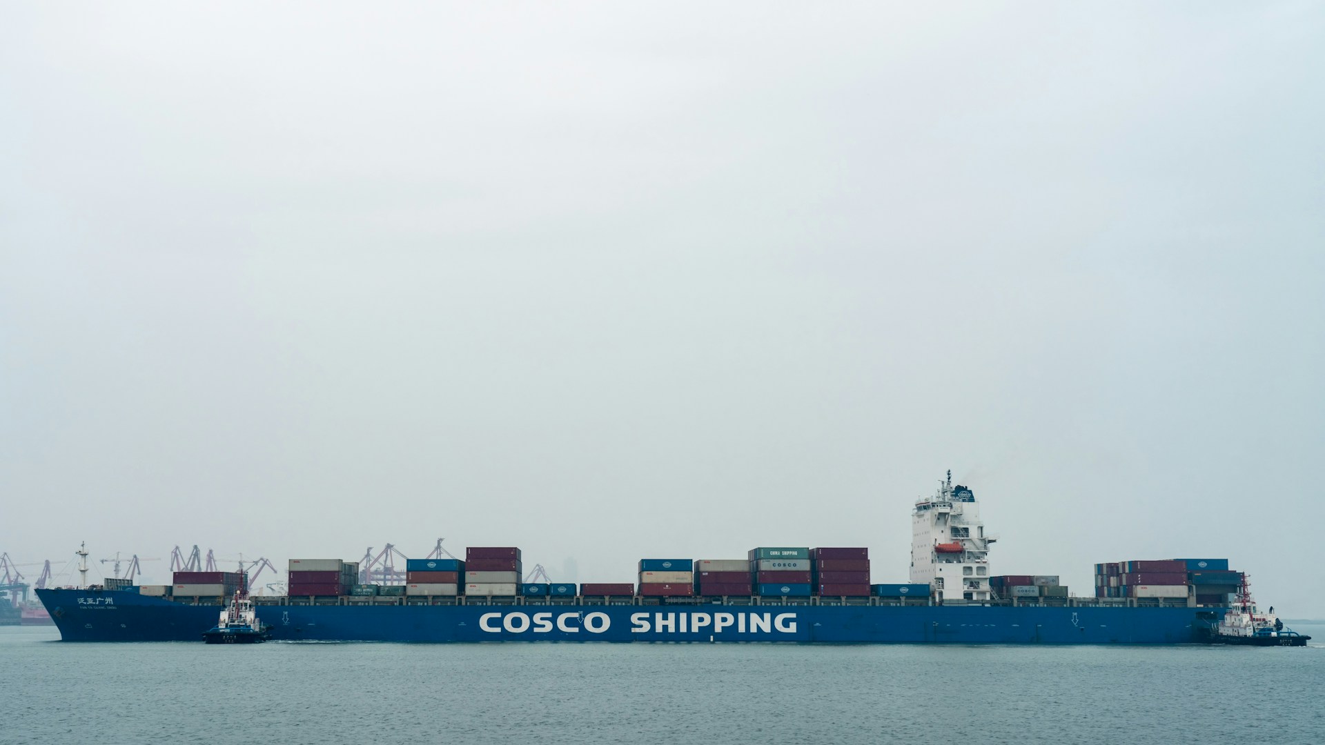 A large cargo ship in the middle of the ocean