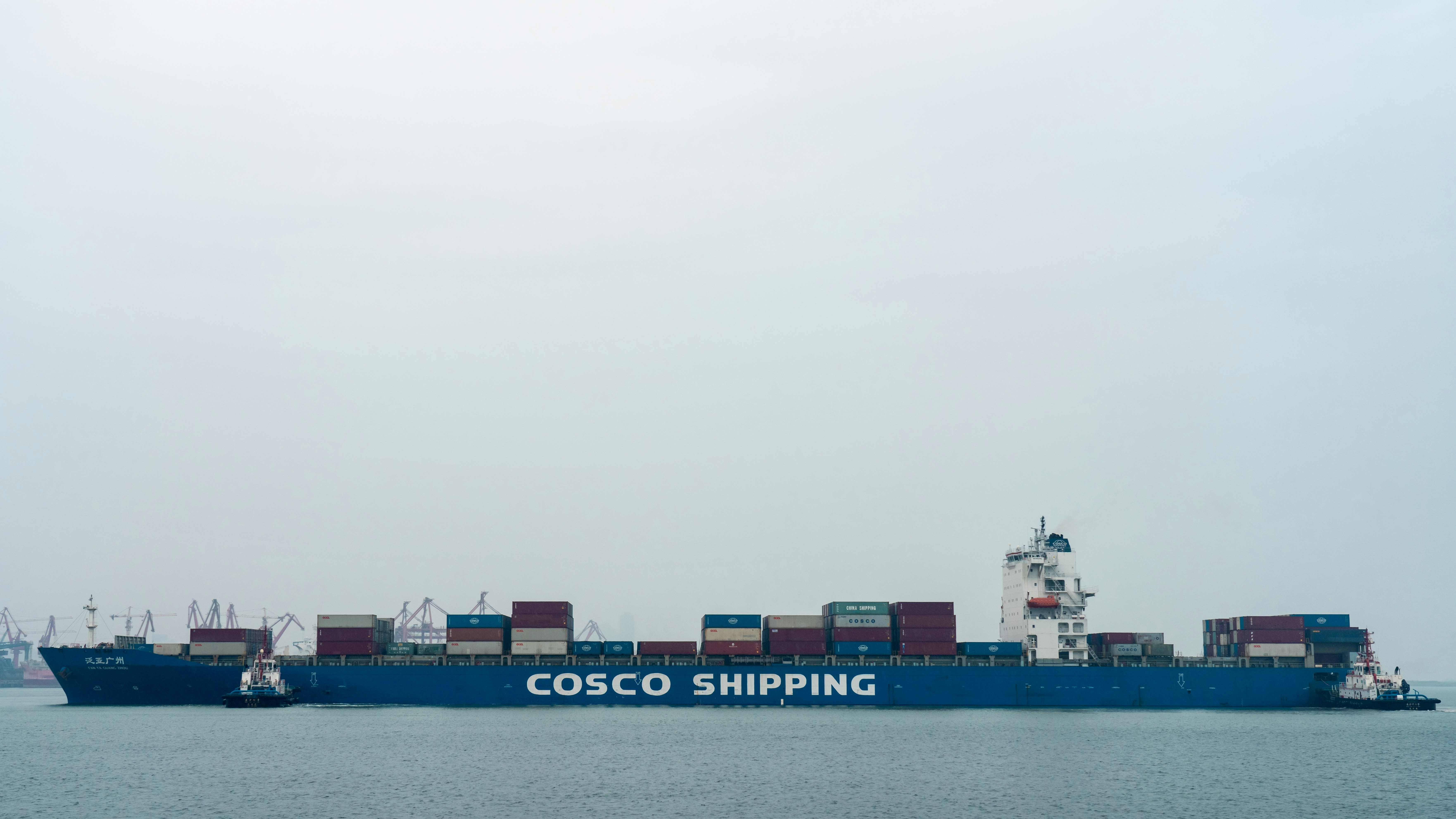 A large cargo ship in the middle of the ocean