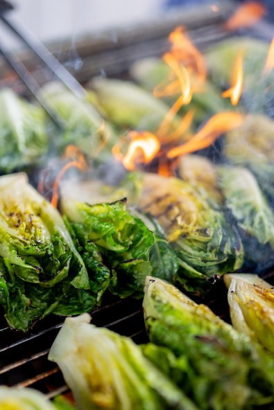 A close up of food cooking on a grill