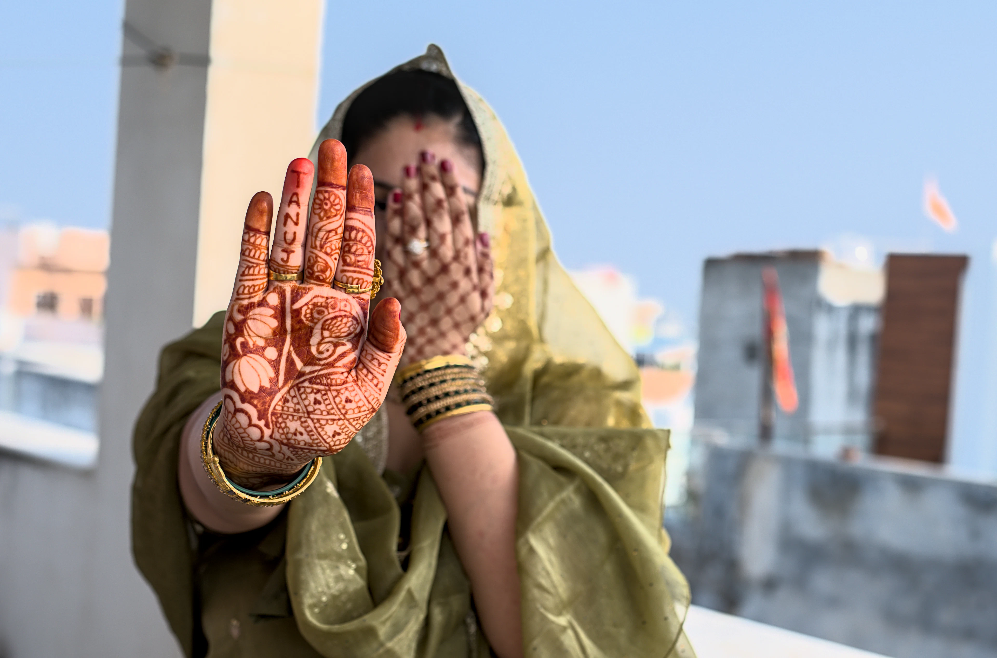 A bail mehndi design — a single decorative vine trailing from the wrist along the back of the hand