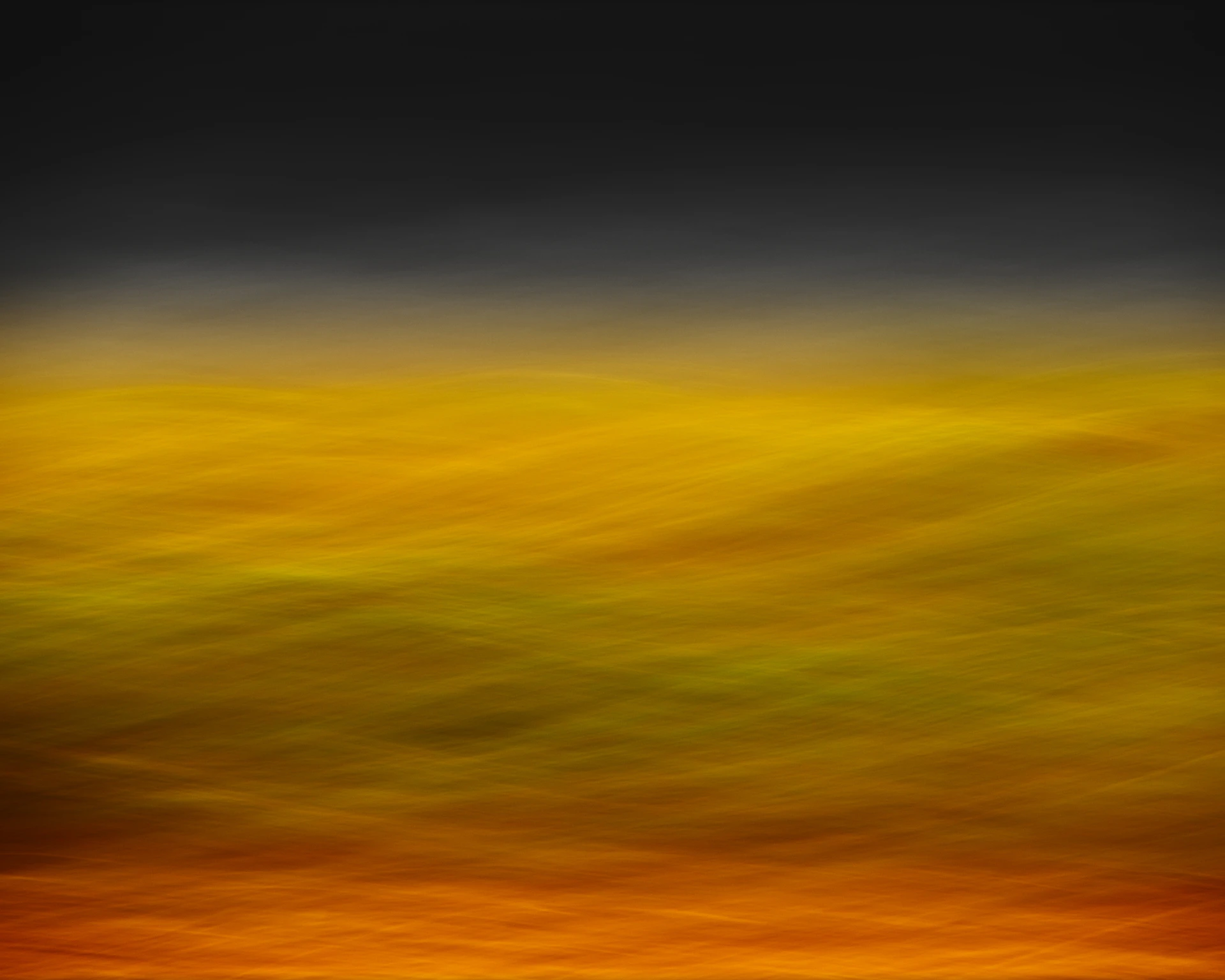 A blurry image of a yellow and black background