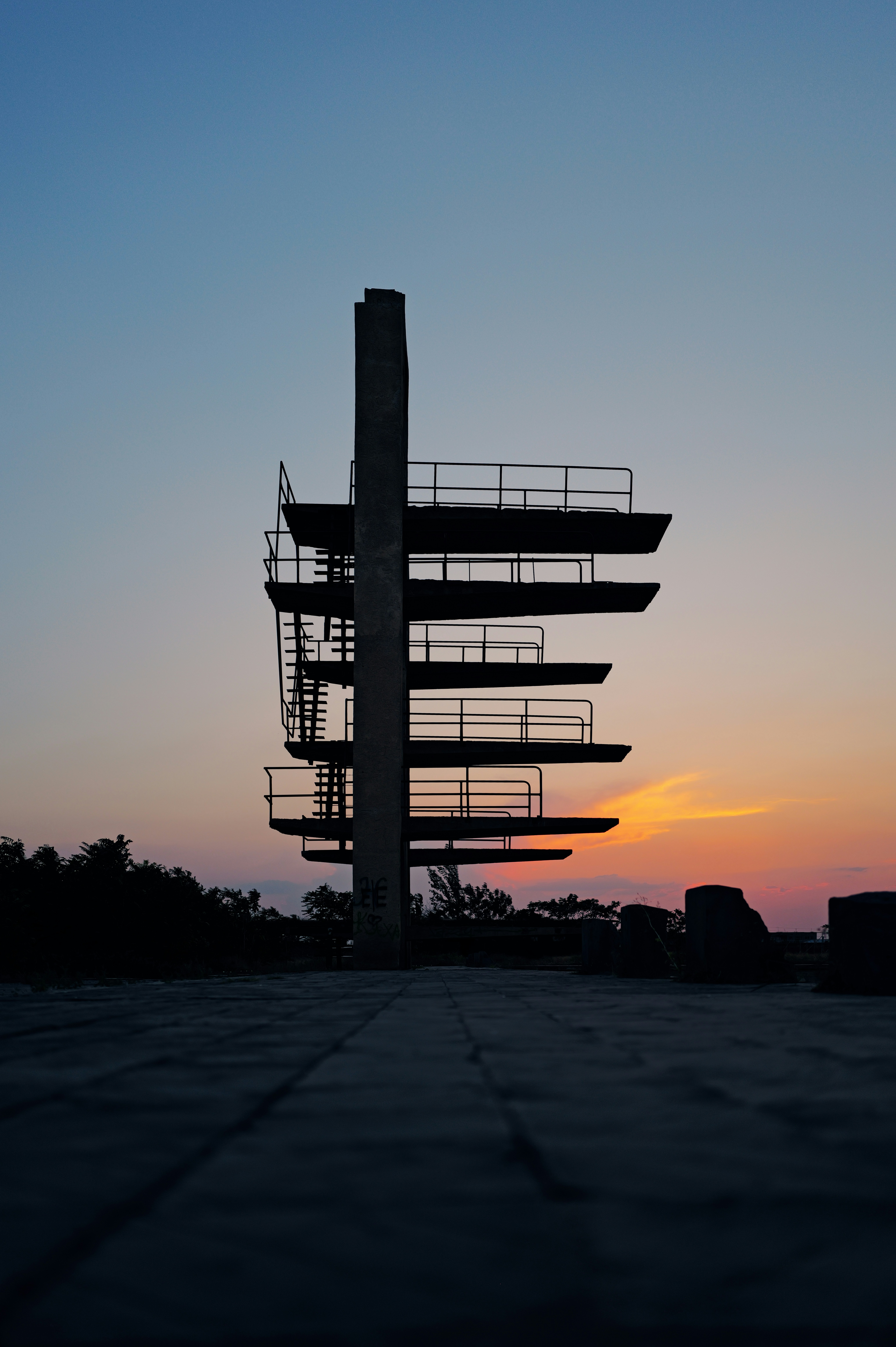 A tall tower with a sky in the background