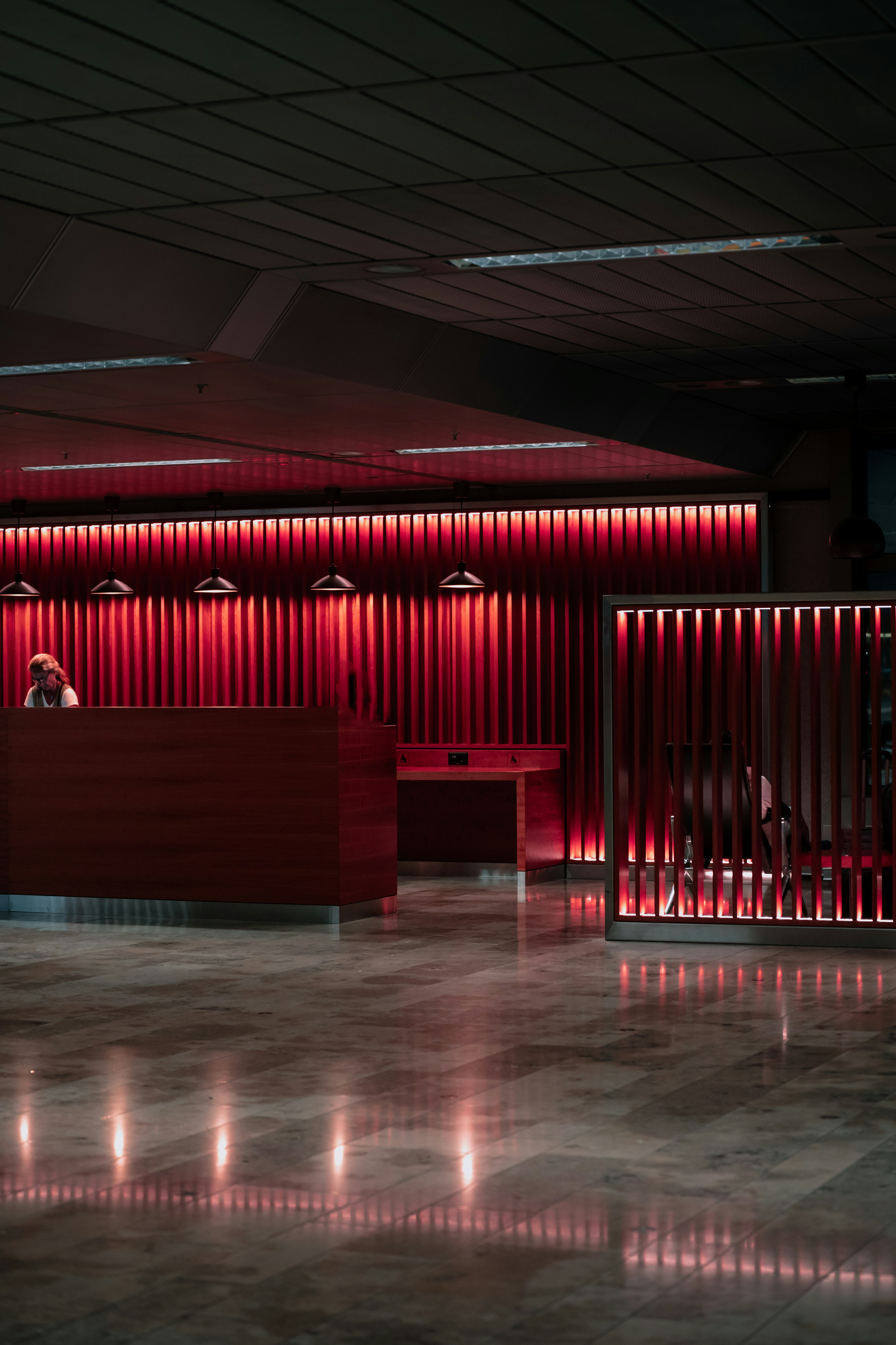 An empty lobby with a red light on the wall