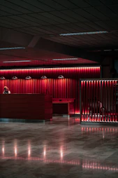 An empty lobby with a red light on the wall
