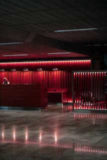An empty lobby with a red light on the wall