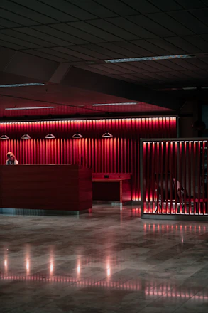 An empty lobby with a red light on the wall