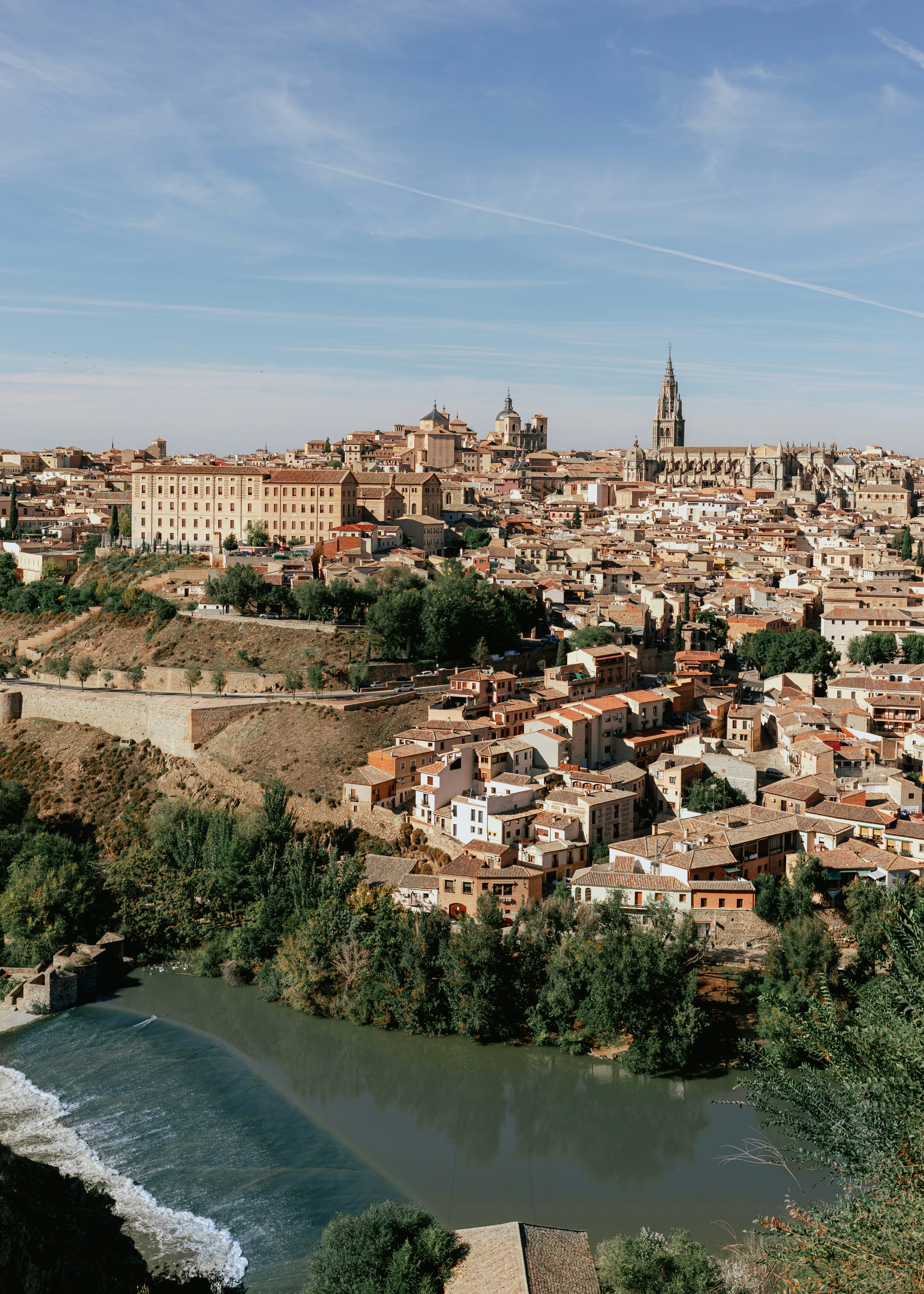 A river running through a city next to a bridge