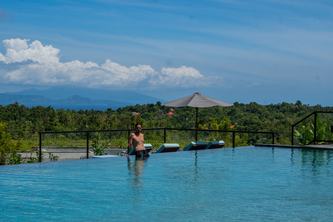 A person standing in the middle of a swimming pool,