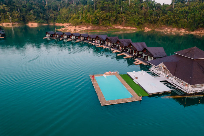 An aerial view of a resort on a lake