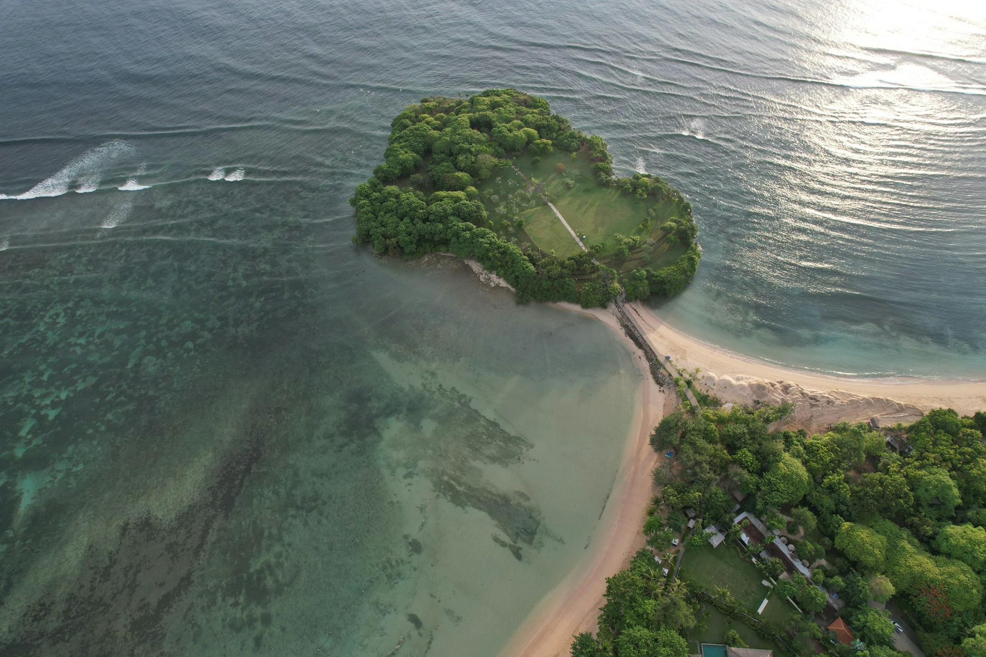 An aerial view of an island in the middle of the ocean