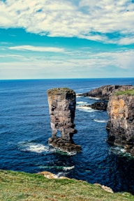 A couple of large rocks sticking out of the ocean