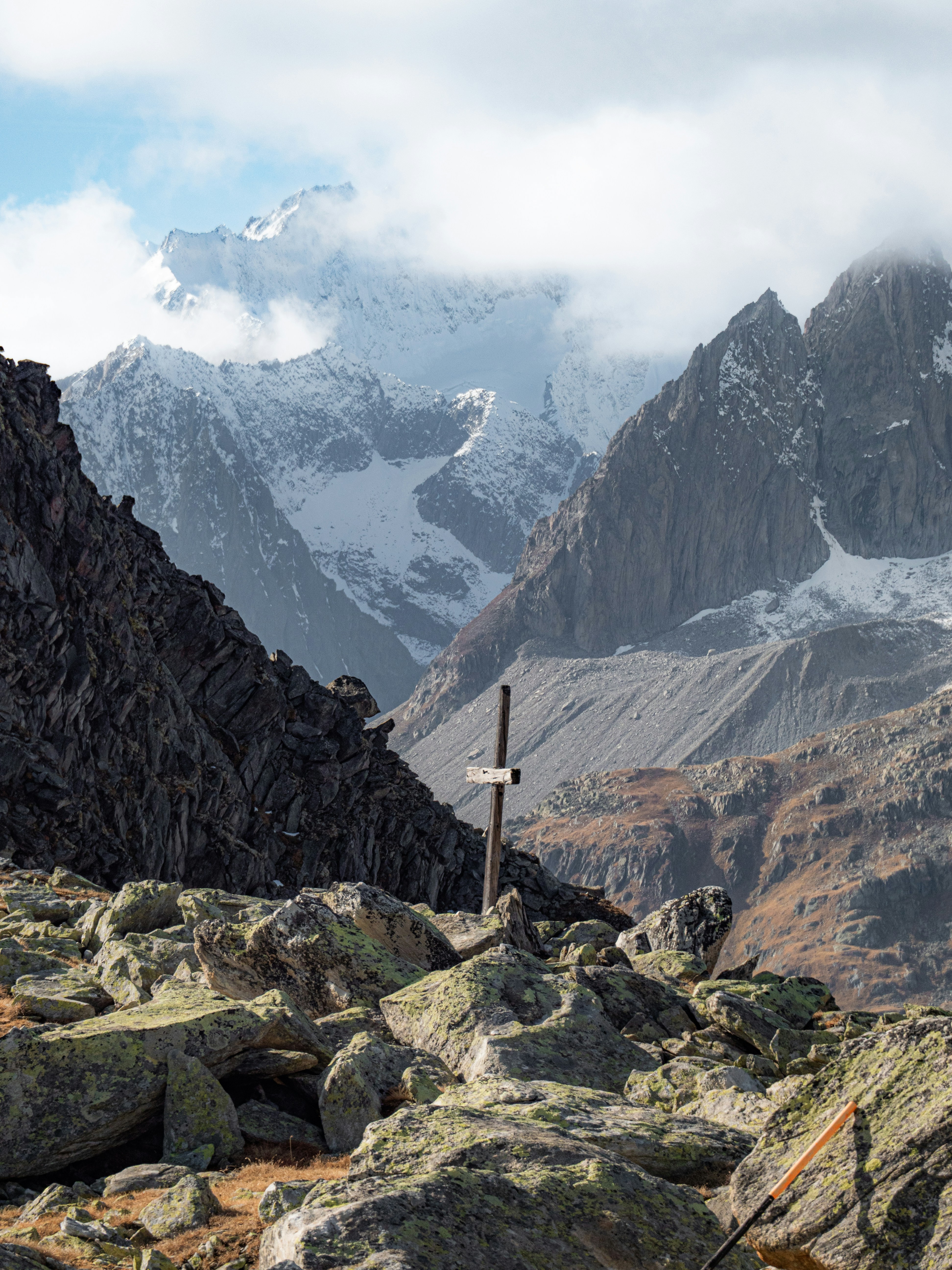 A cross in the middle of a mountain range