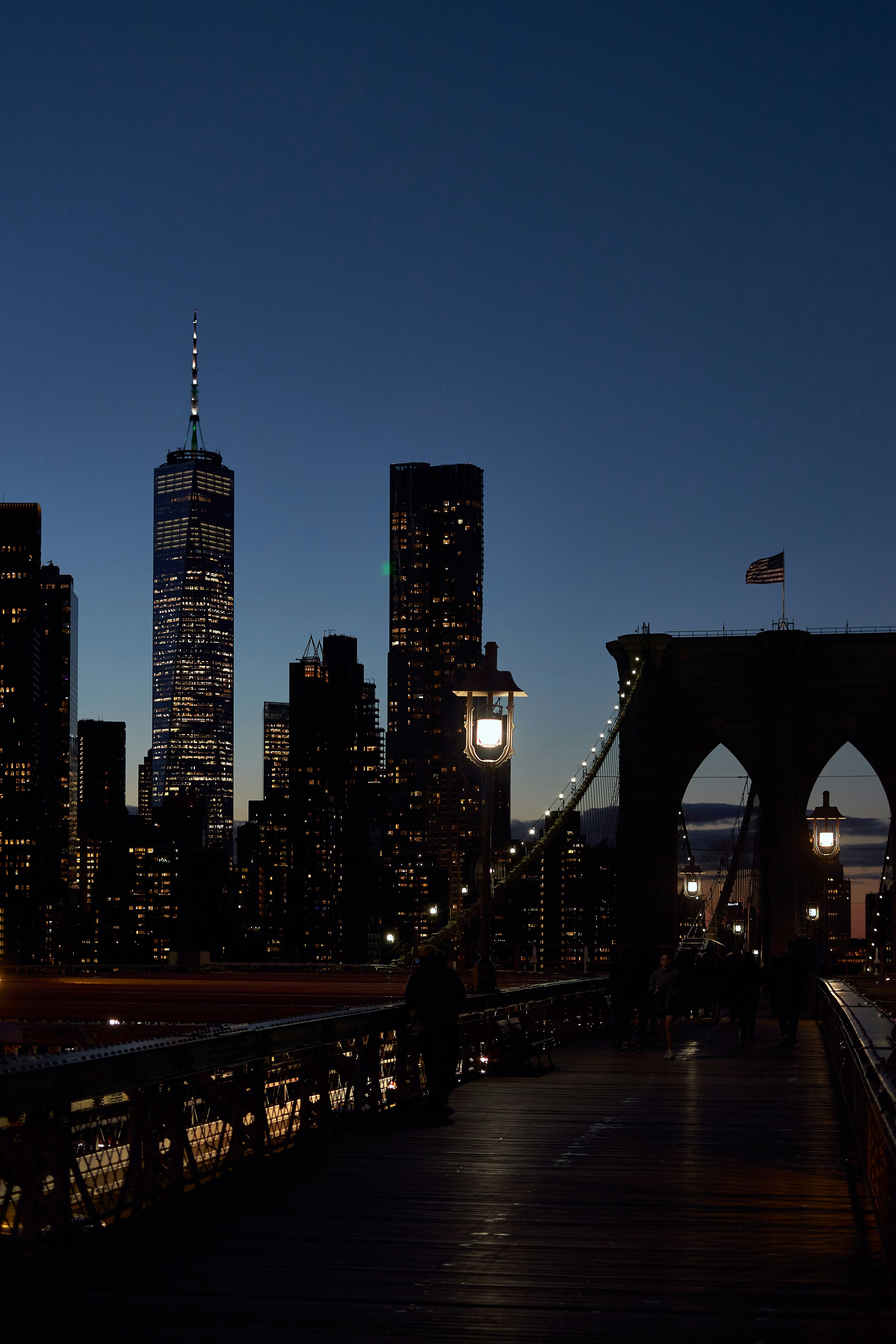 A view of a city at night from a bridge