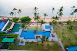 An aerial view of a resort with a swimming pool