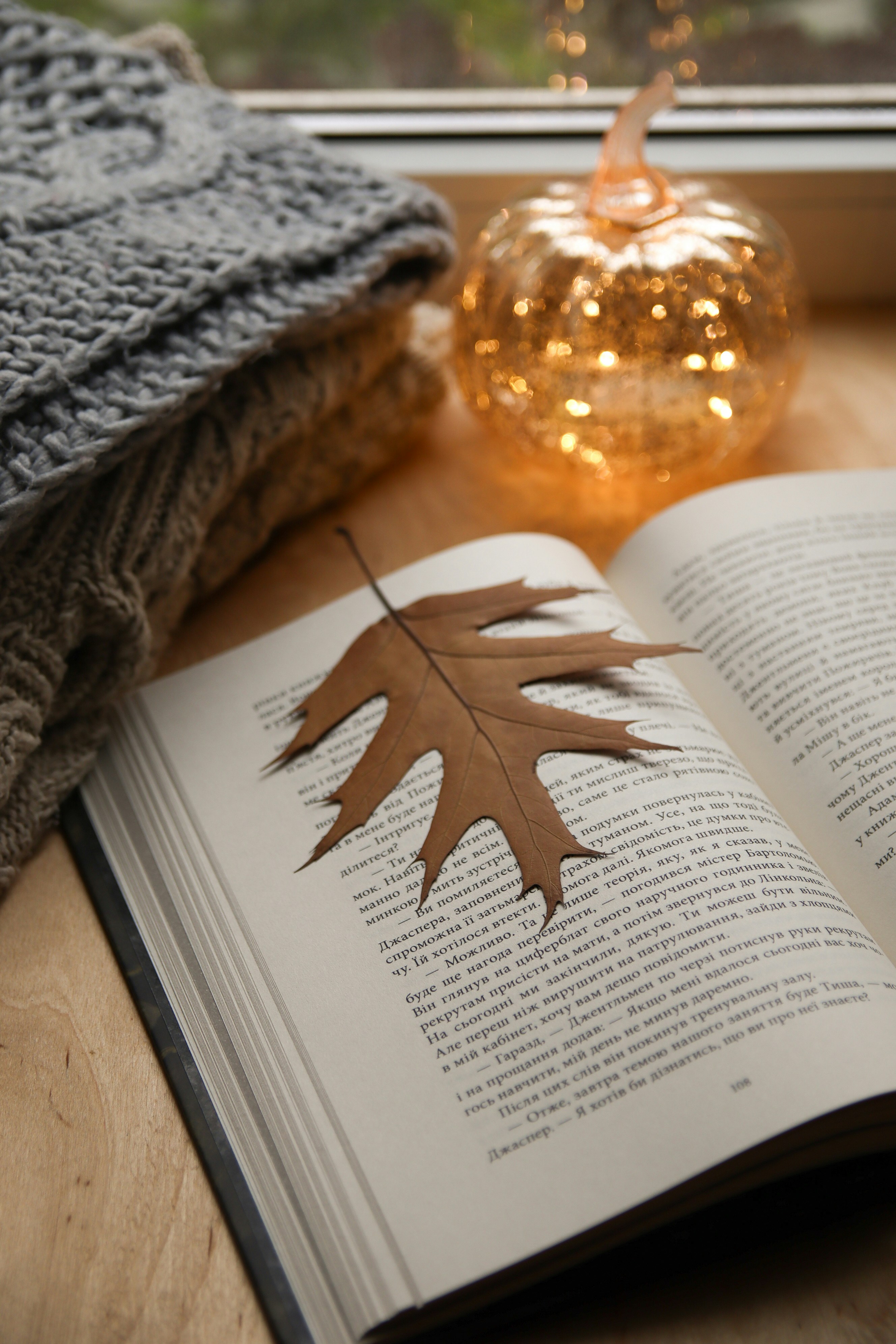 An open book sitting on top of a wooden table