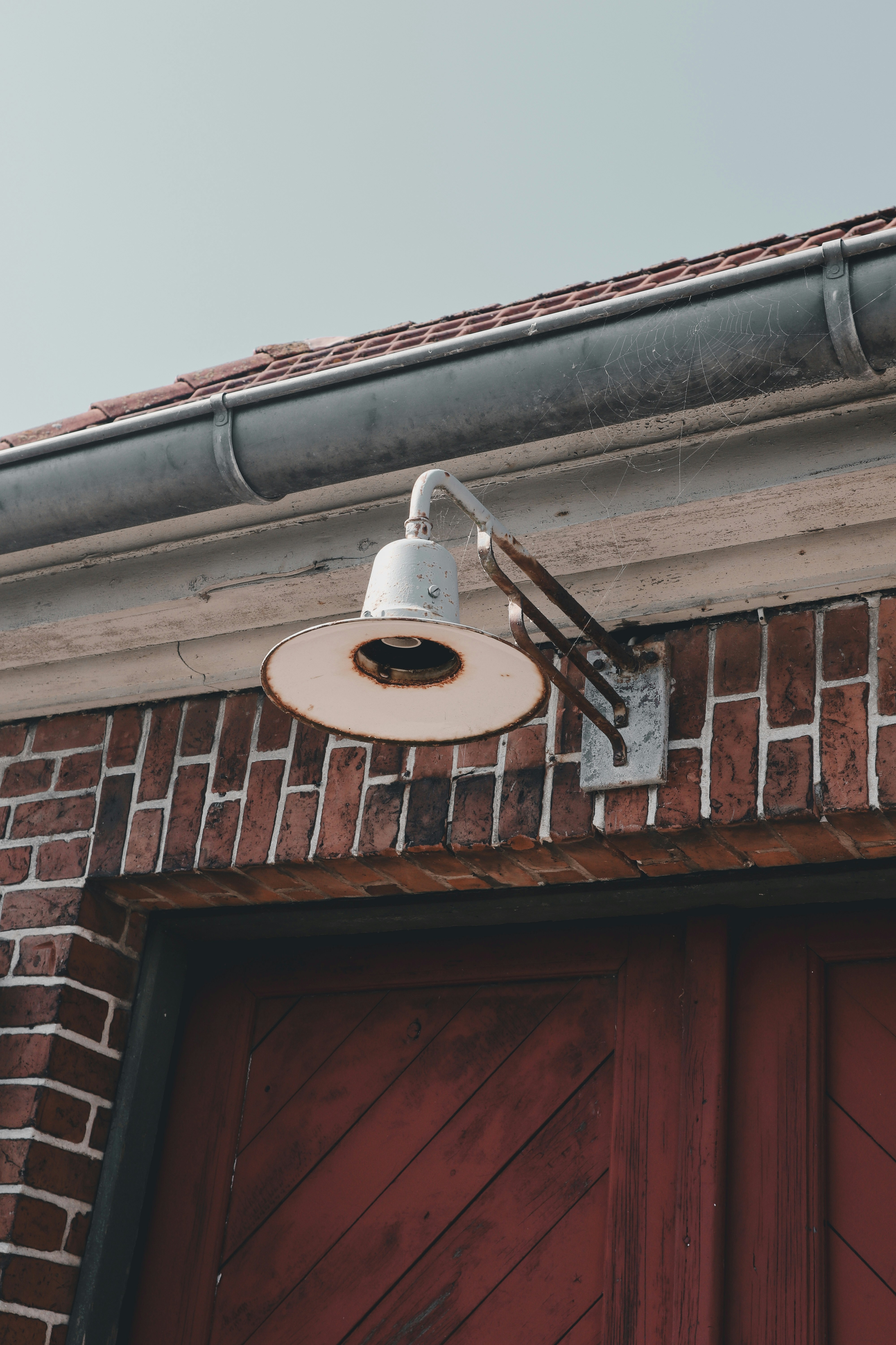 A red brick building with a light on top of it