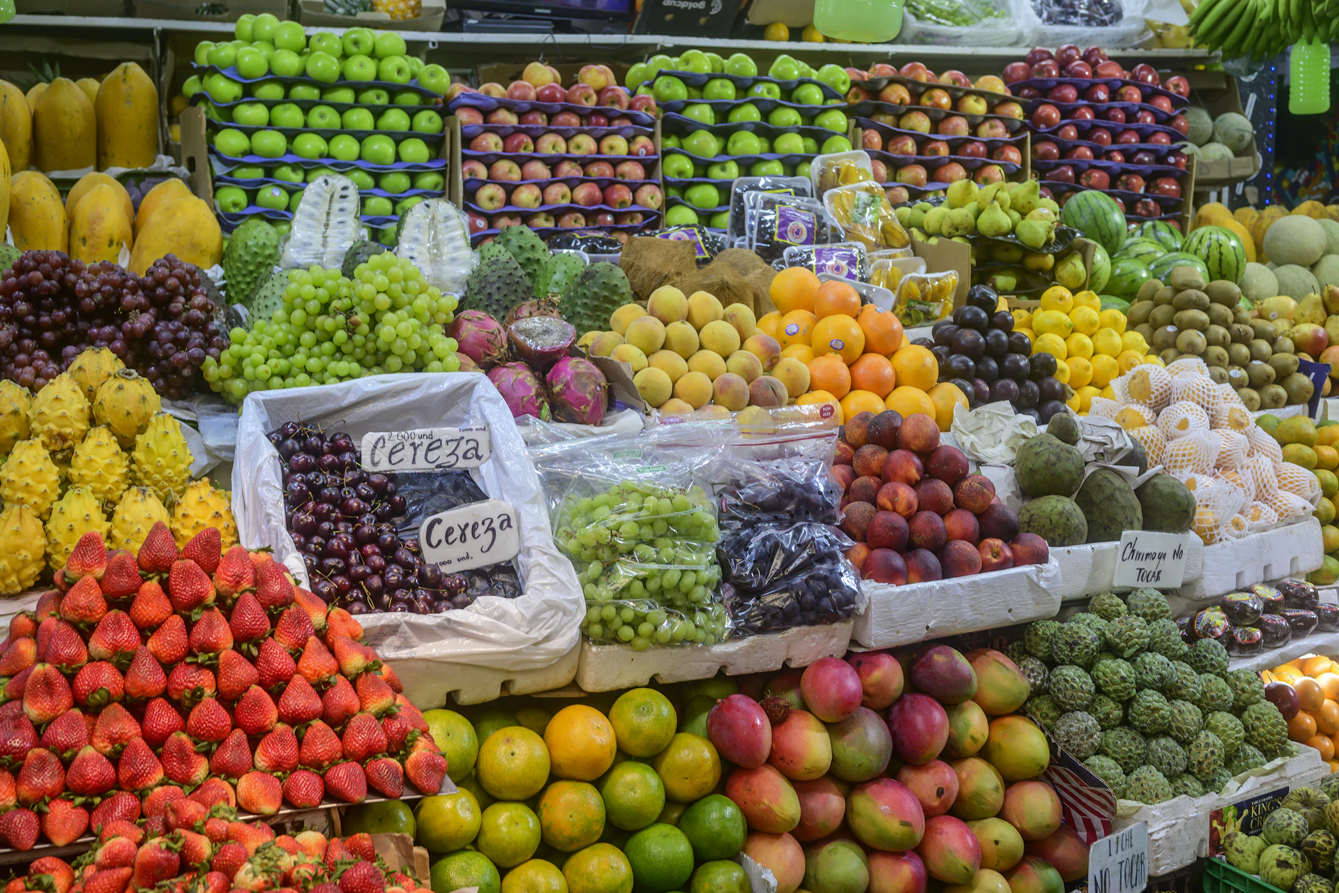 A large display of fruits and vegetables for sale