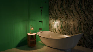 A bathroom with a tub and a green wall
