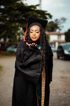 A woman in a graduation cap and gown
