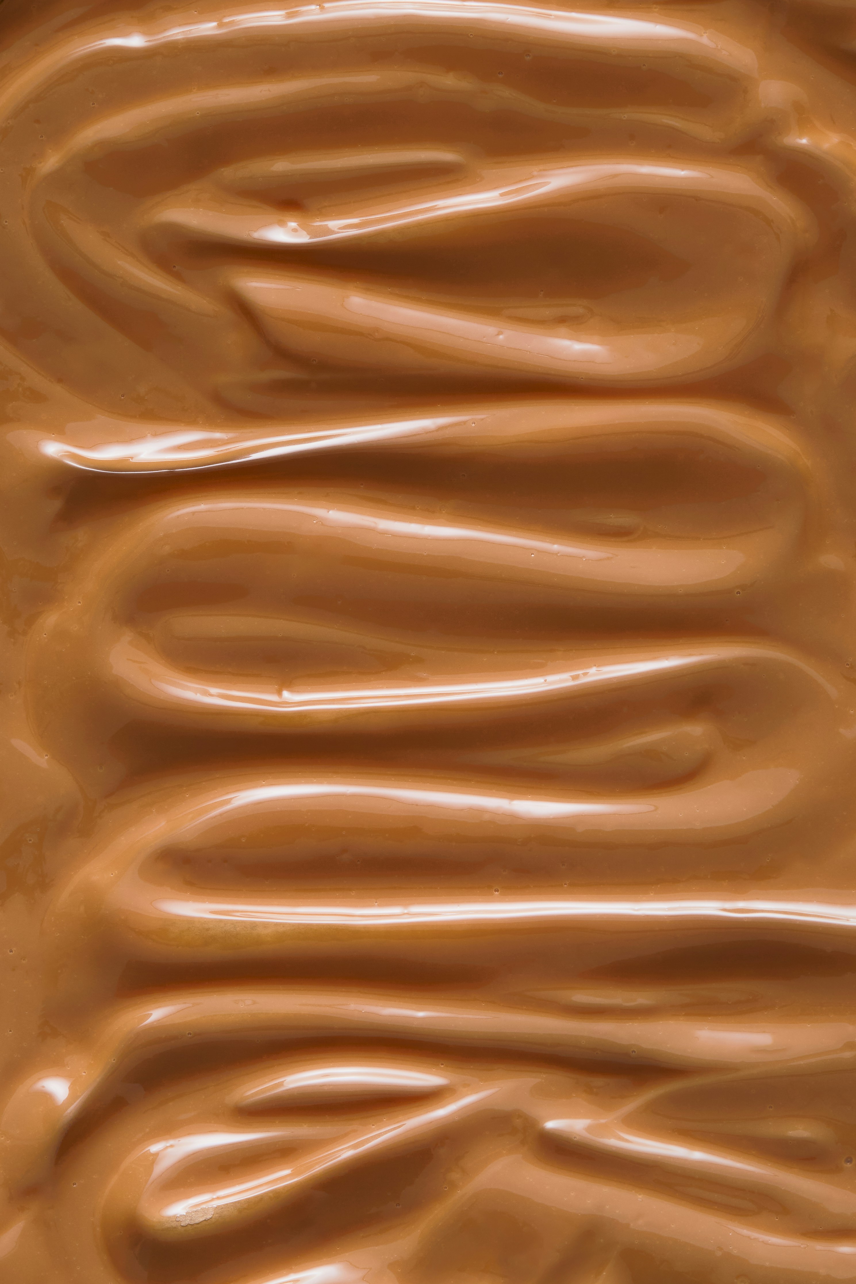 A close up of a chocolate frosted surface