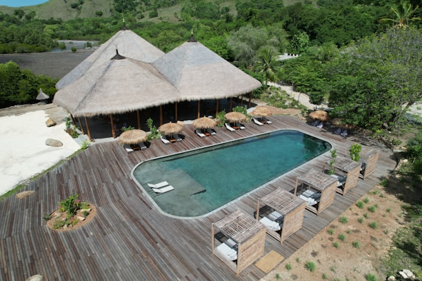 An aerial view of a resort with a pool