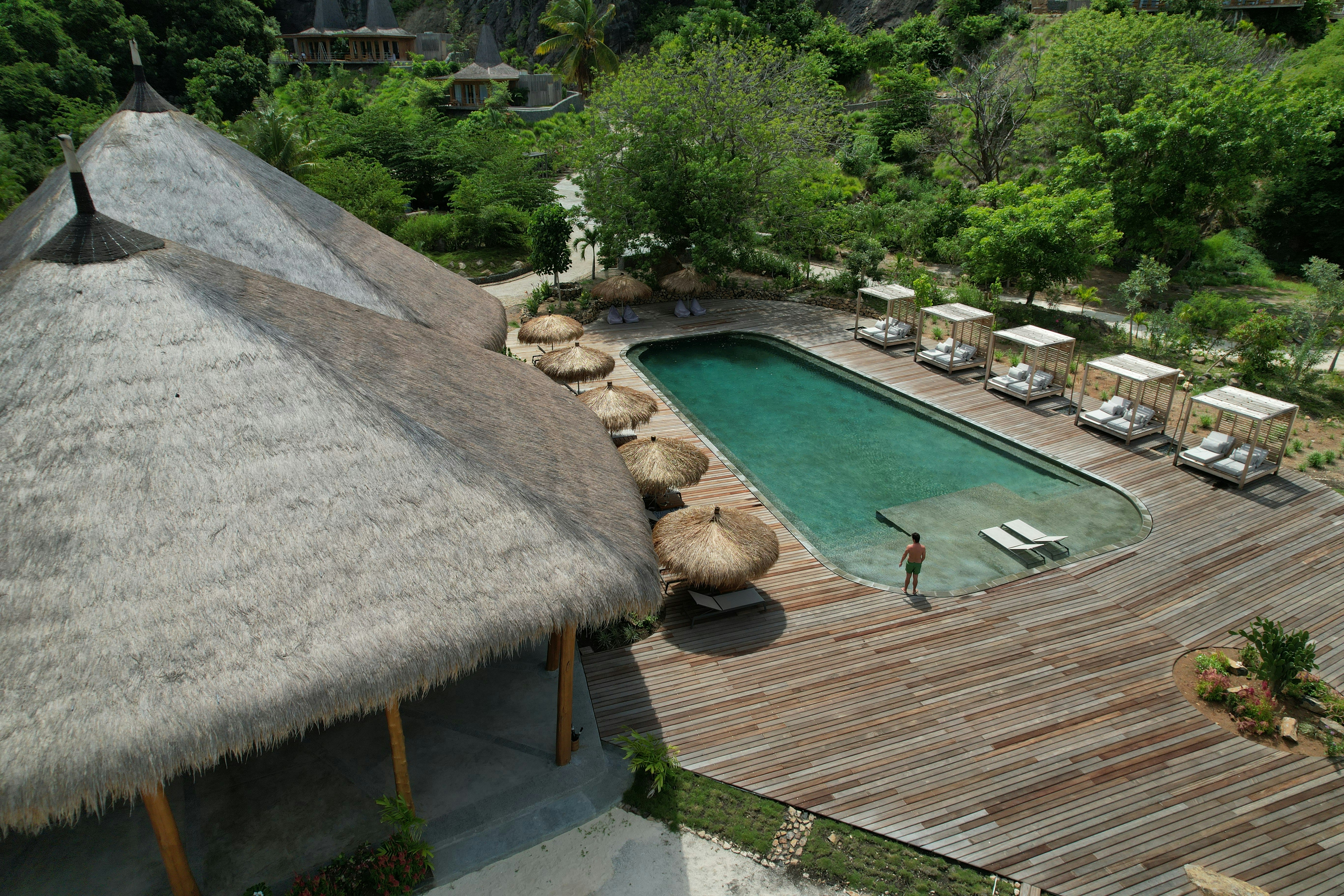 An aerial view of a resort with a pool