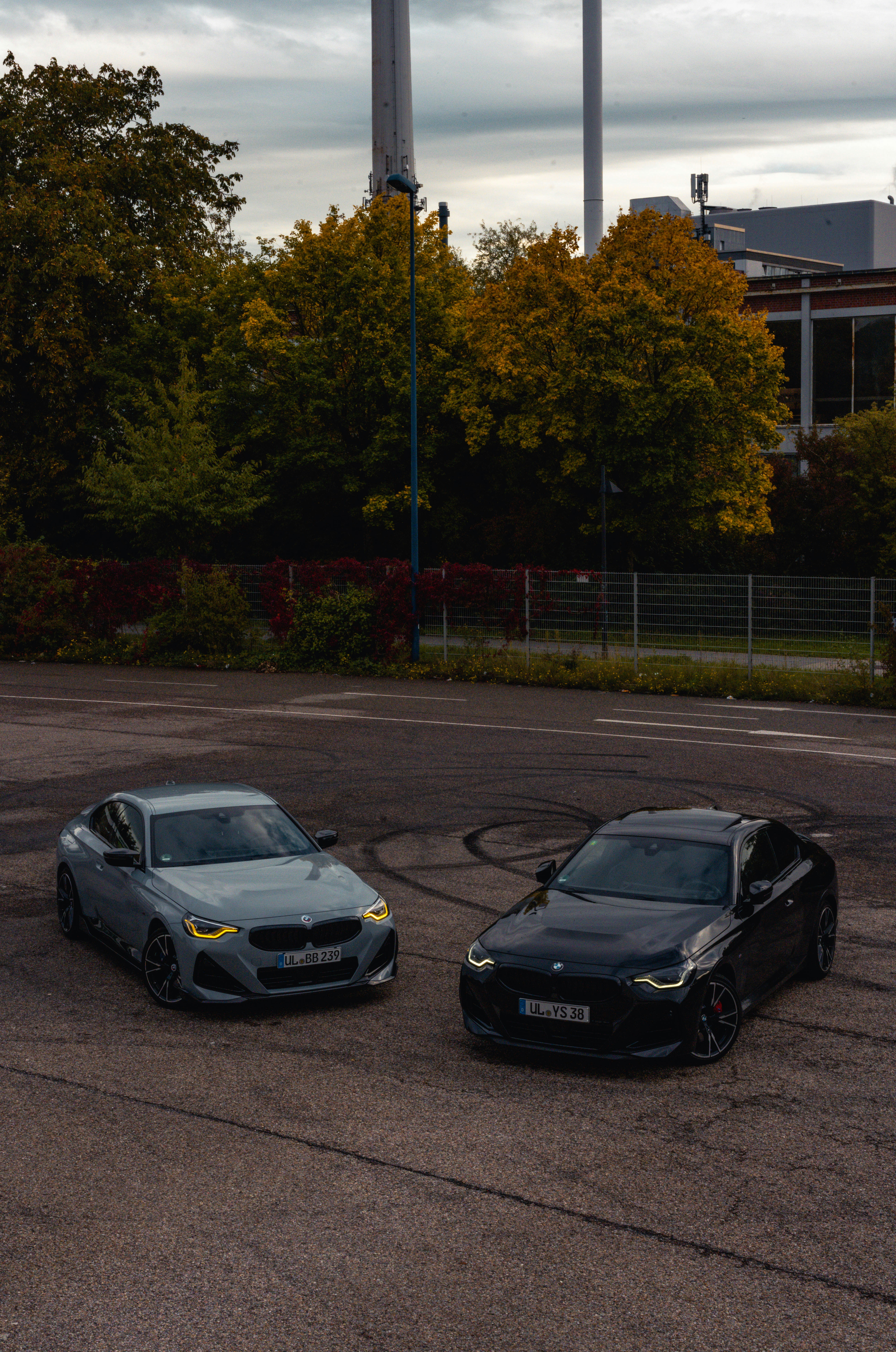 A couple of cars parked in a parking lot