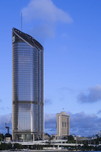 A very tall building sitting next to a body of water