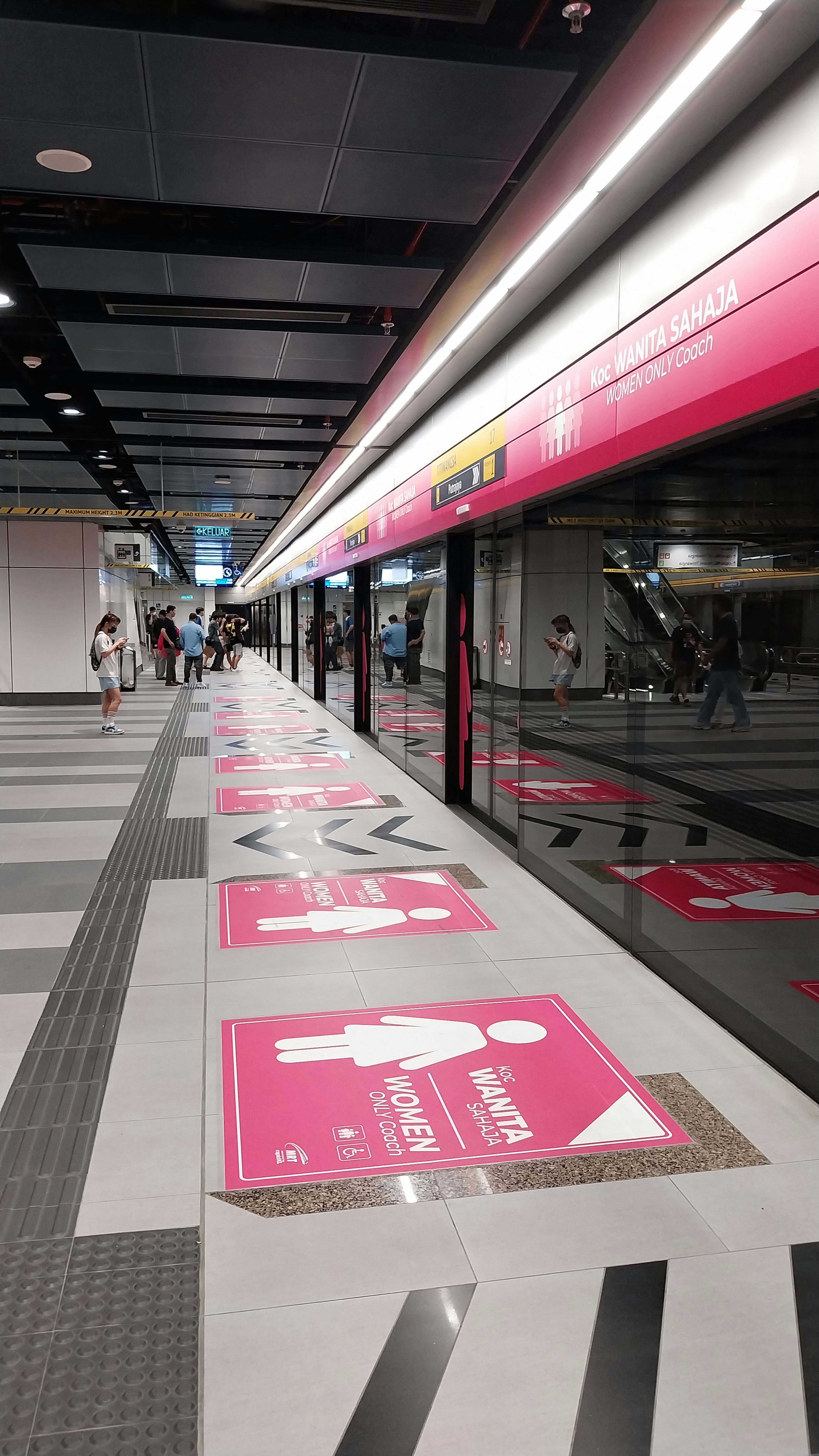 A train station with a lot of signs on the floor