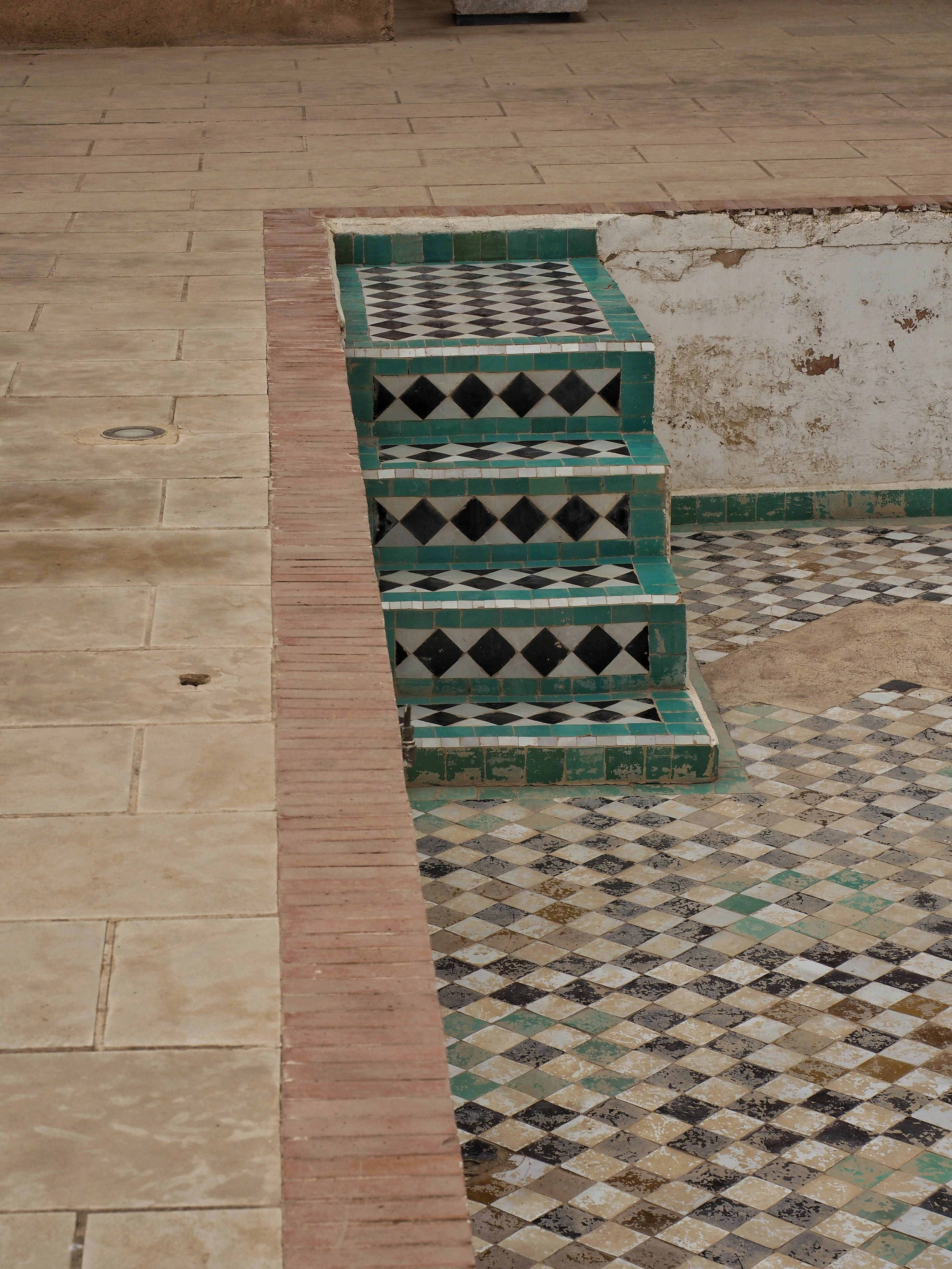 Tiled steps leading into an old pool