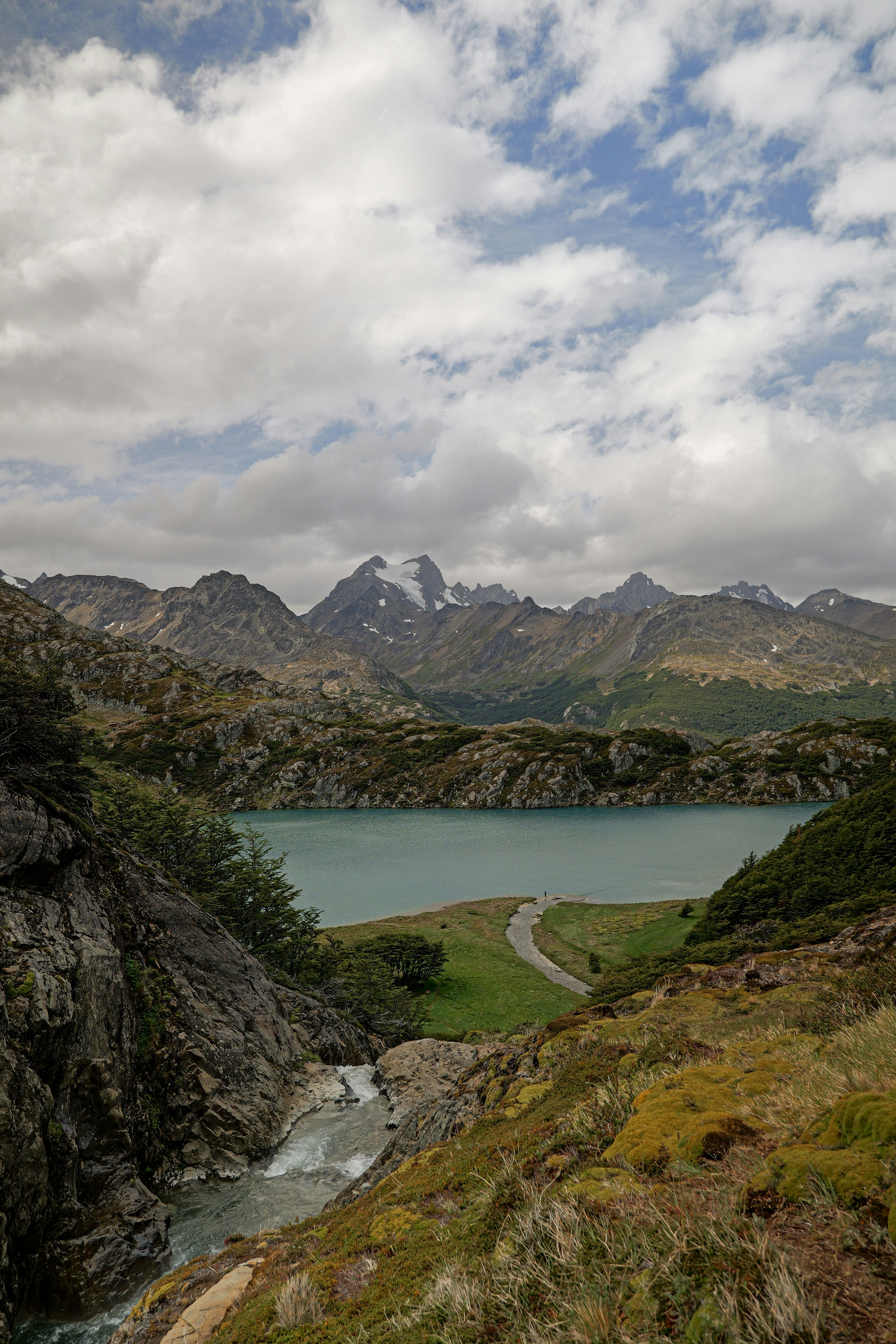 A river running through a lush green valley