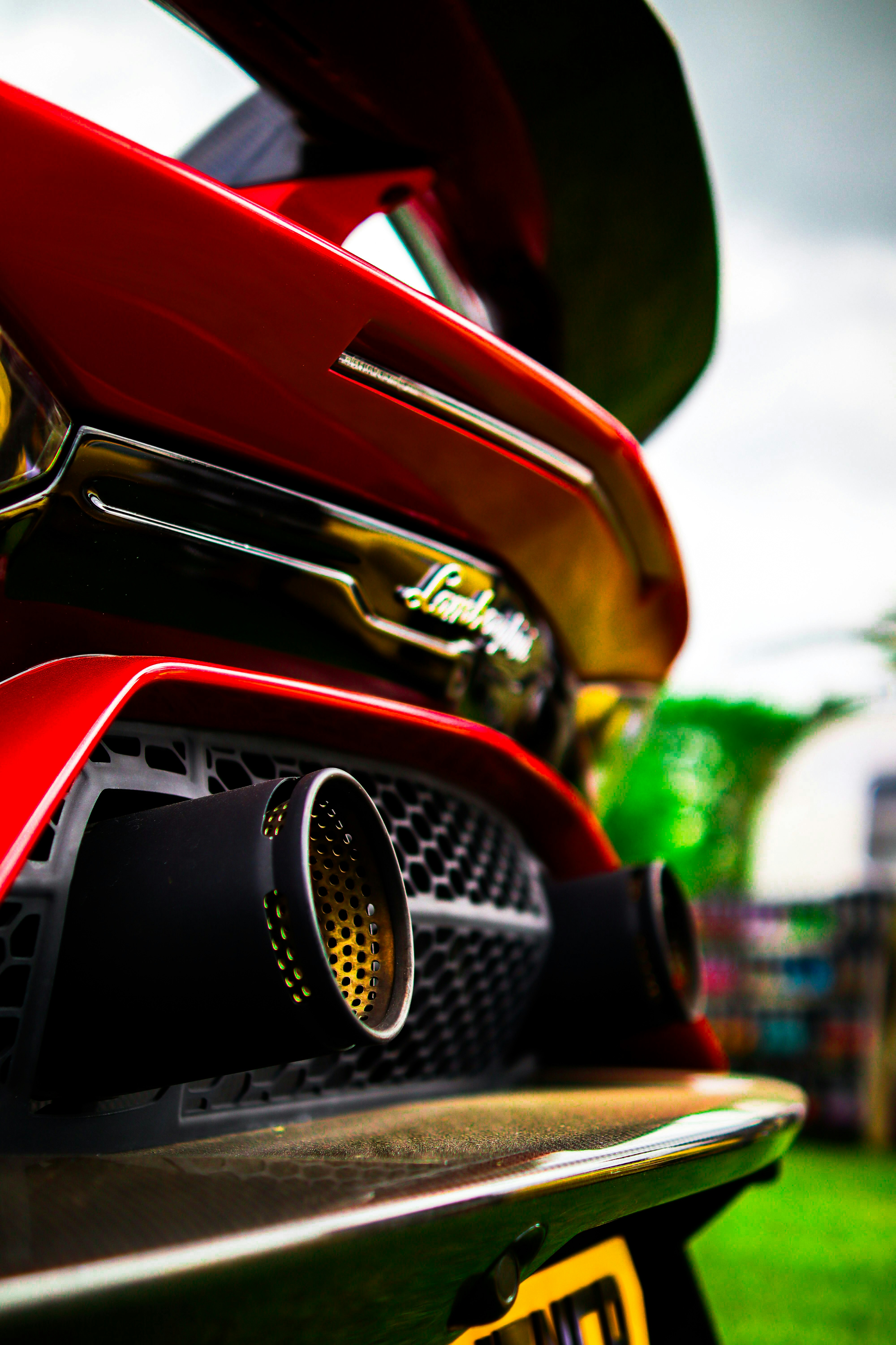 A close up of the front of a red sports car