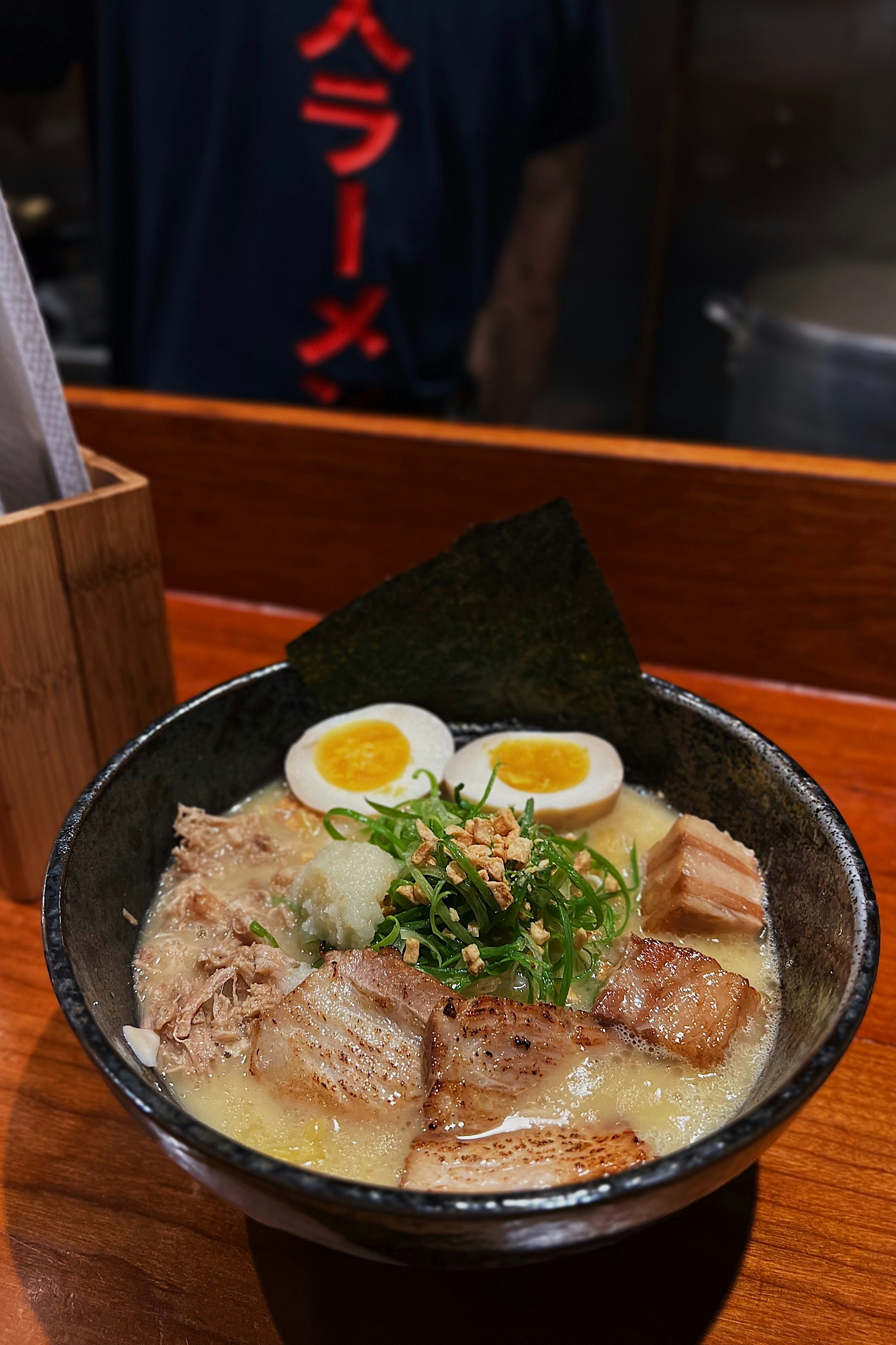 A bowl of food on a wooden table