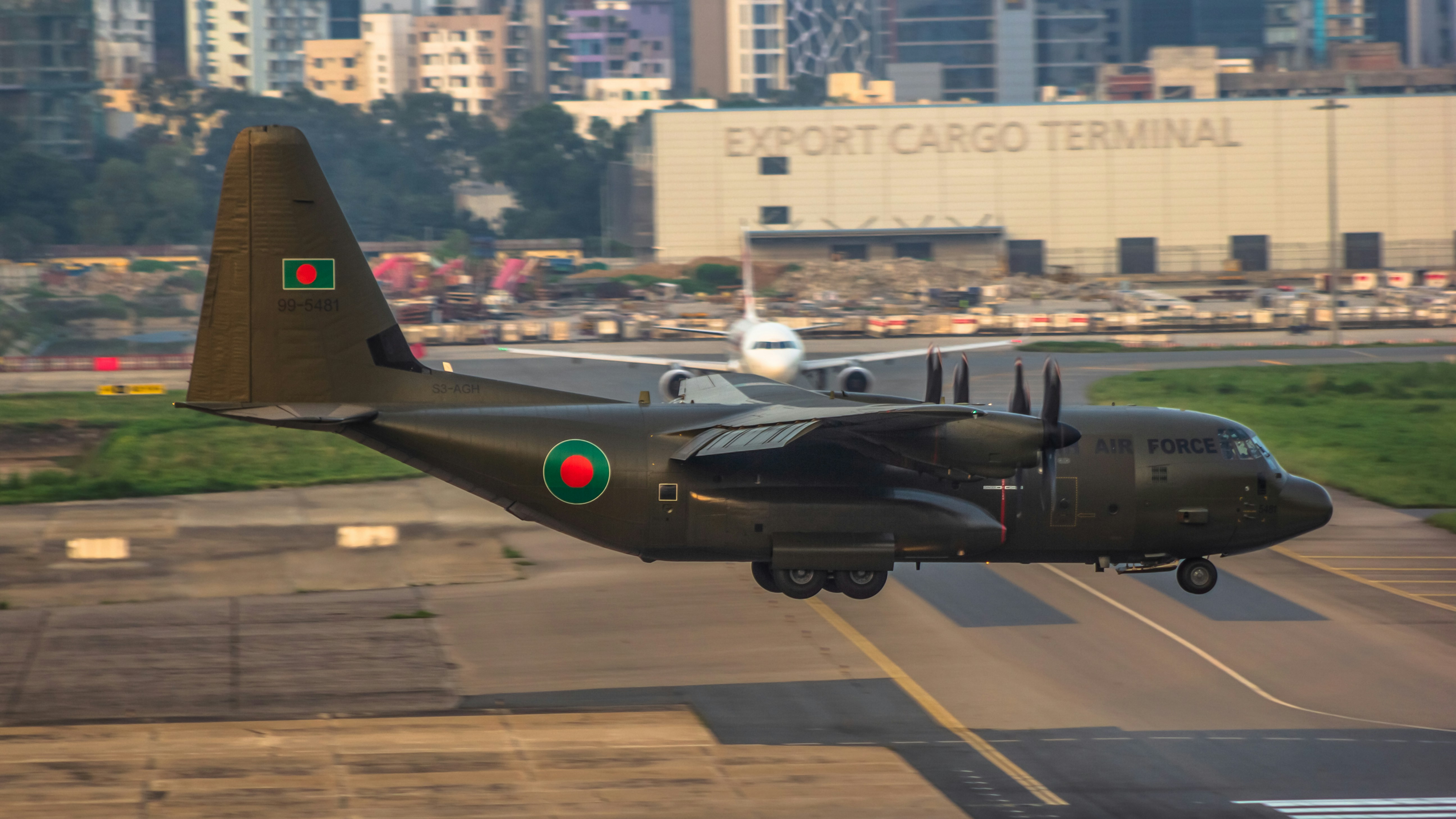 A small plane taking off from an airport runway